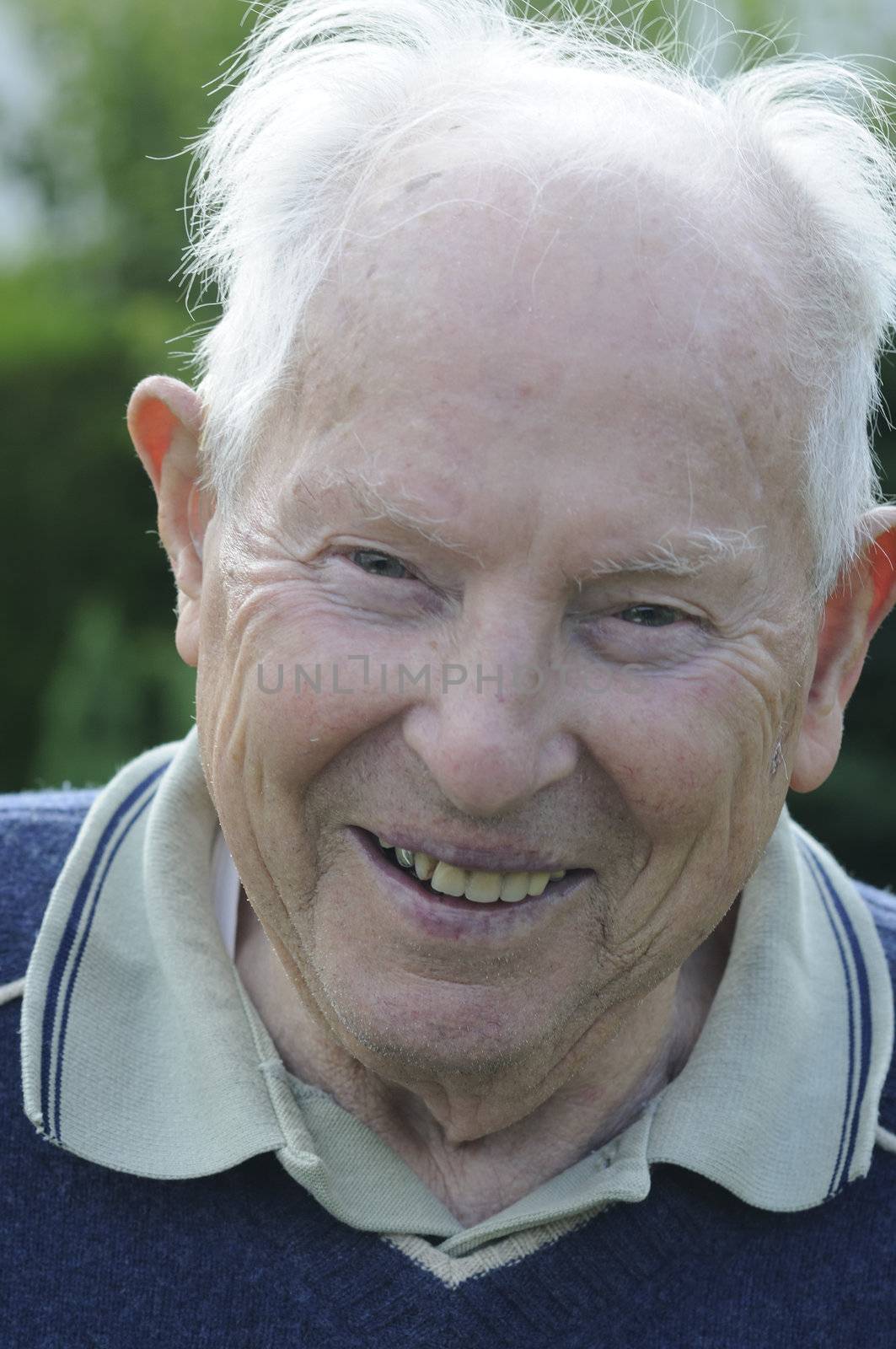 90 years old man laughing and feeling happy.