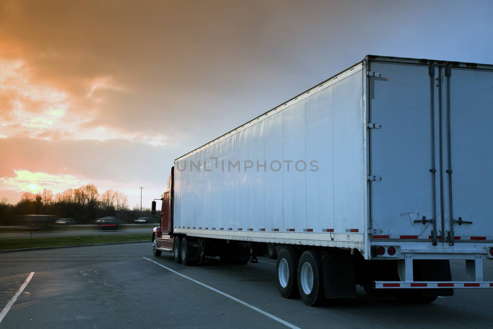 Semi Truck Parked on rest area. Sunset time - tobacco graduated filter used.