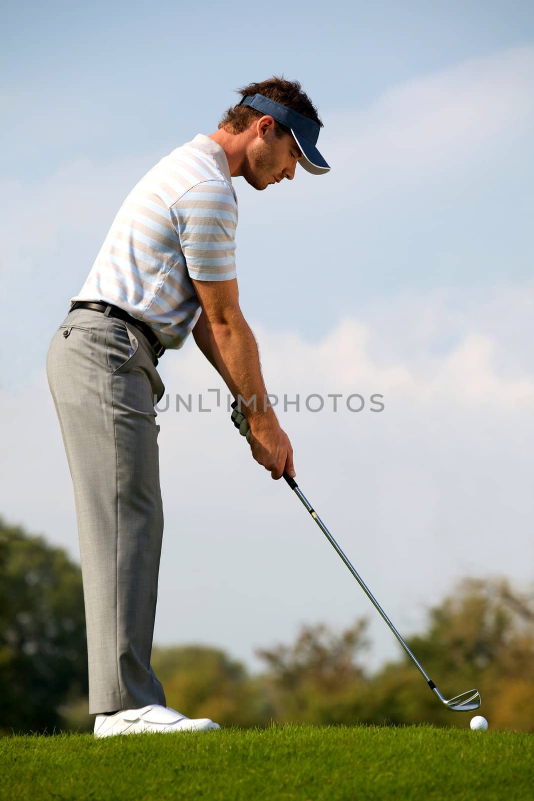 Young man playing golf