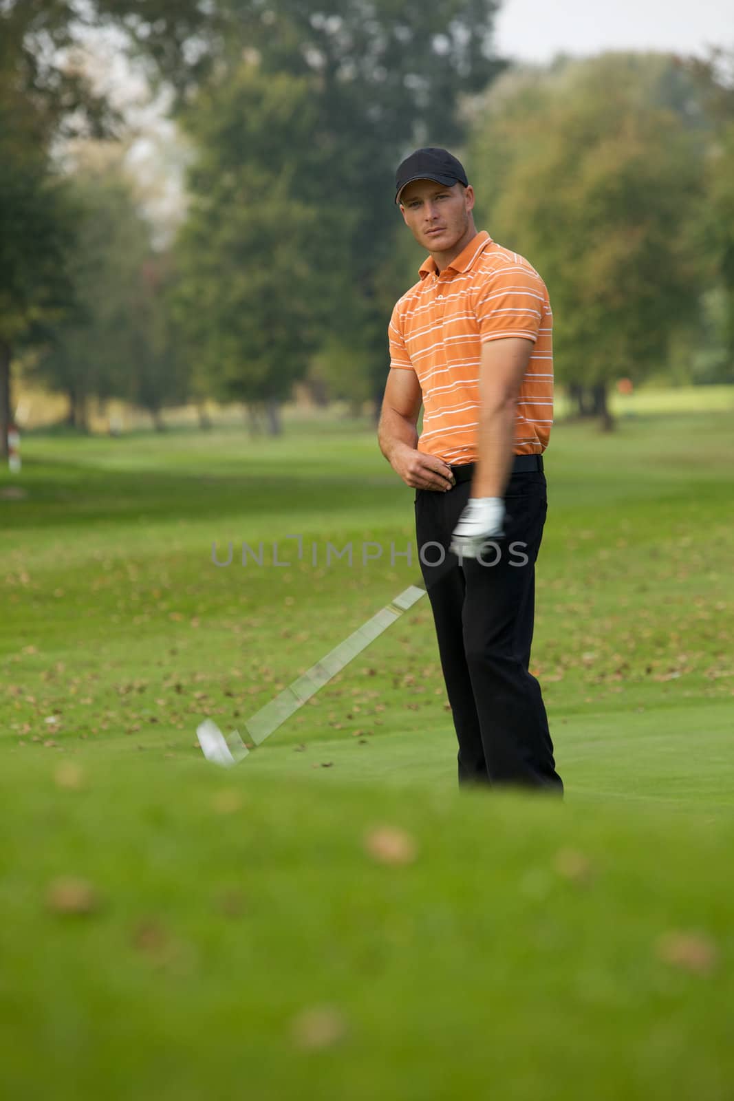 Young man playing golf