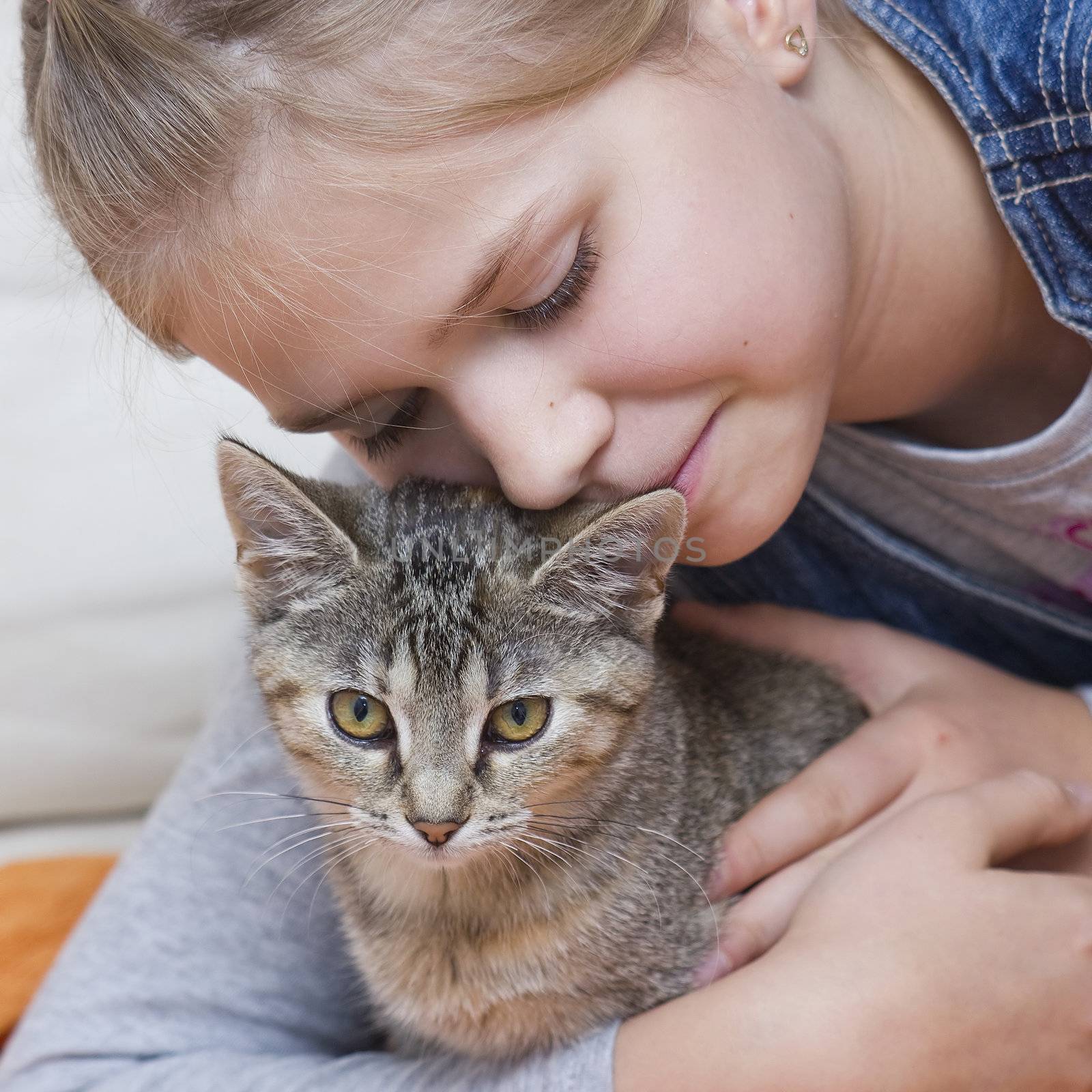 Portrait of child with kitten 