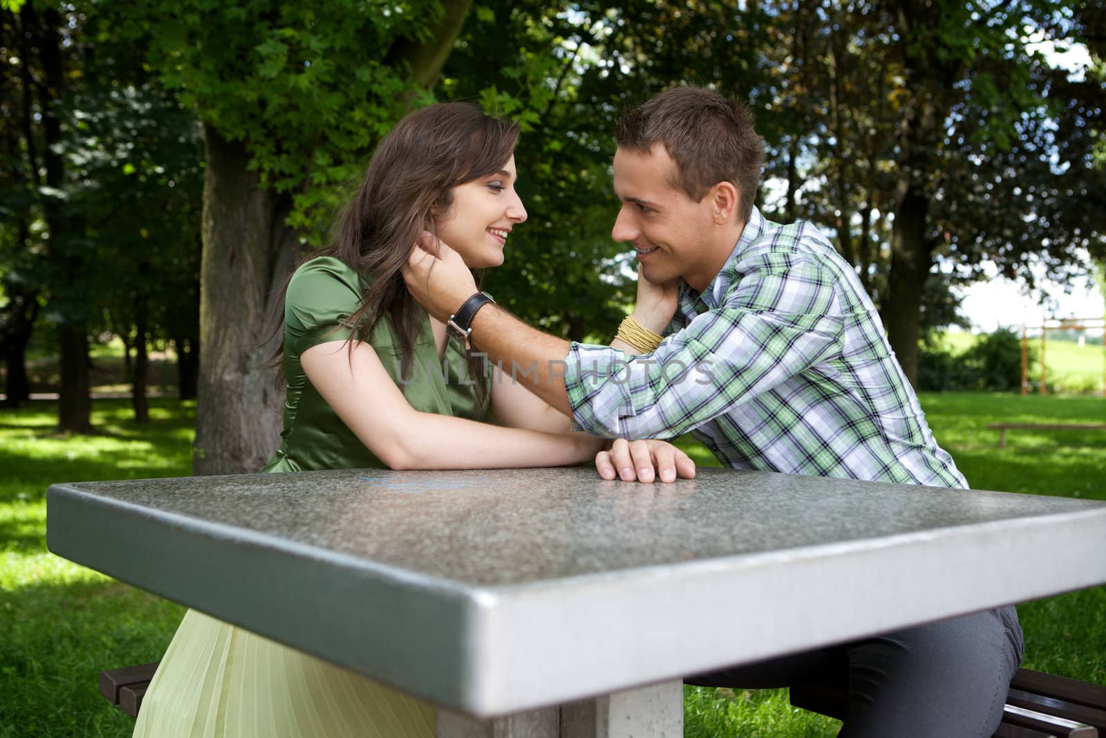 Young couple with hand on chin of each other