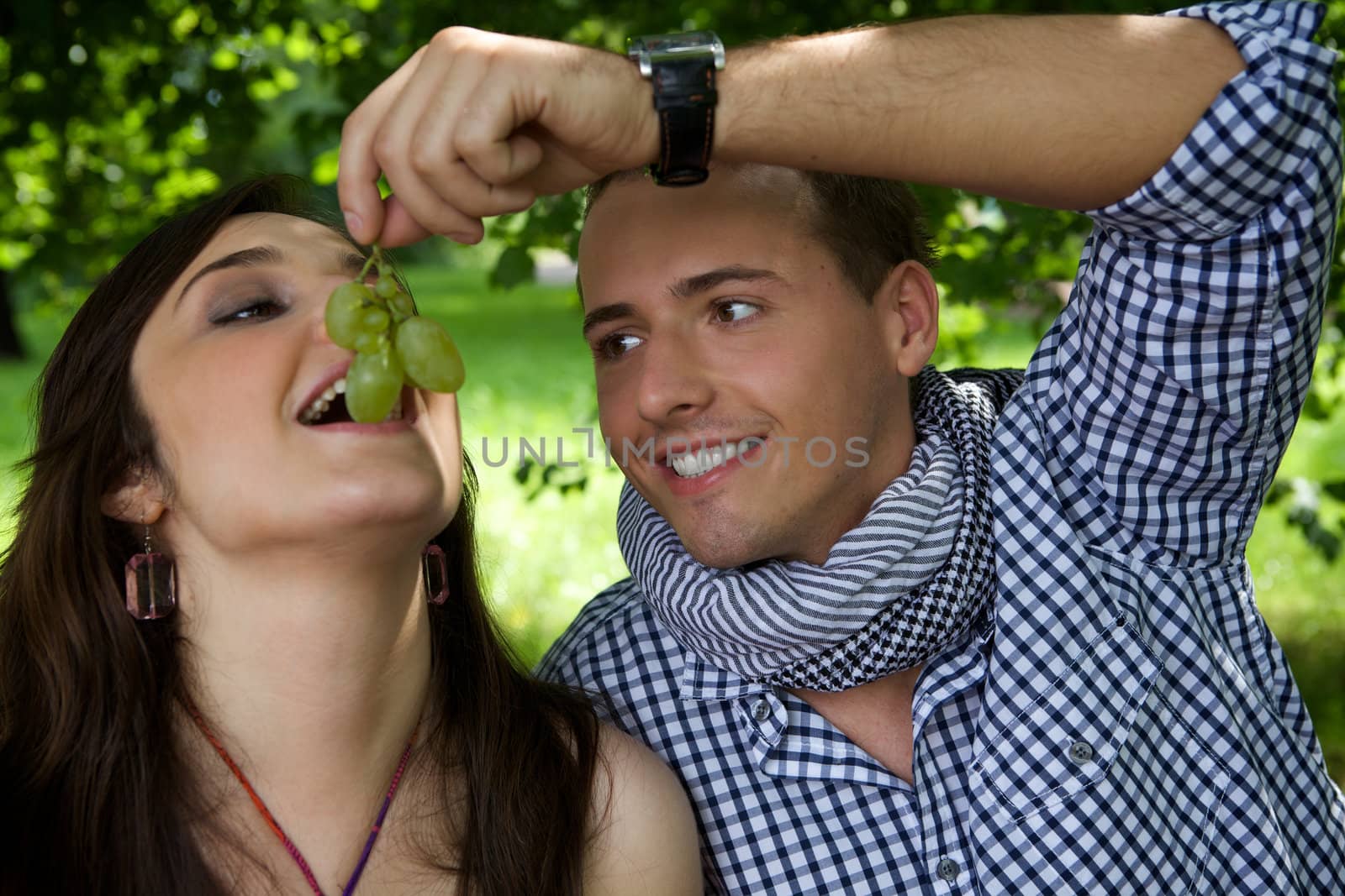 Boyfriend feeding girlfriend