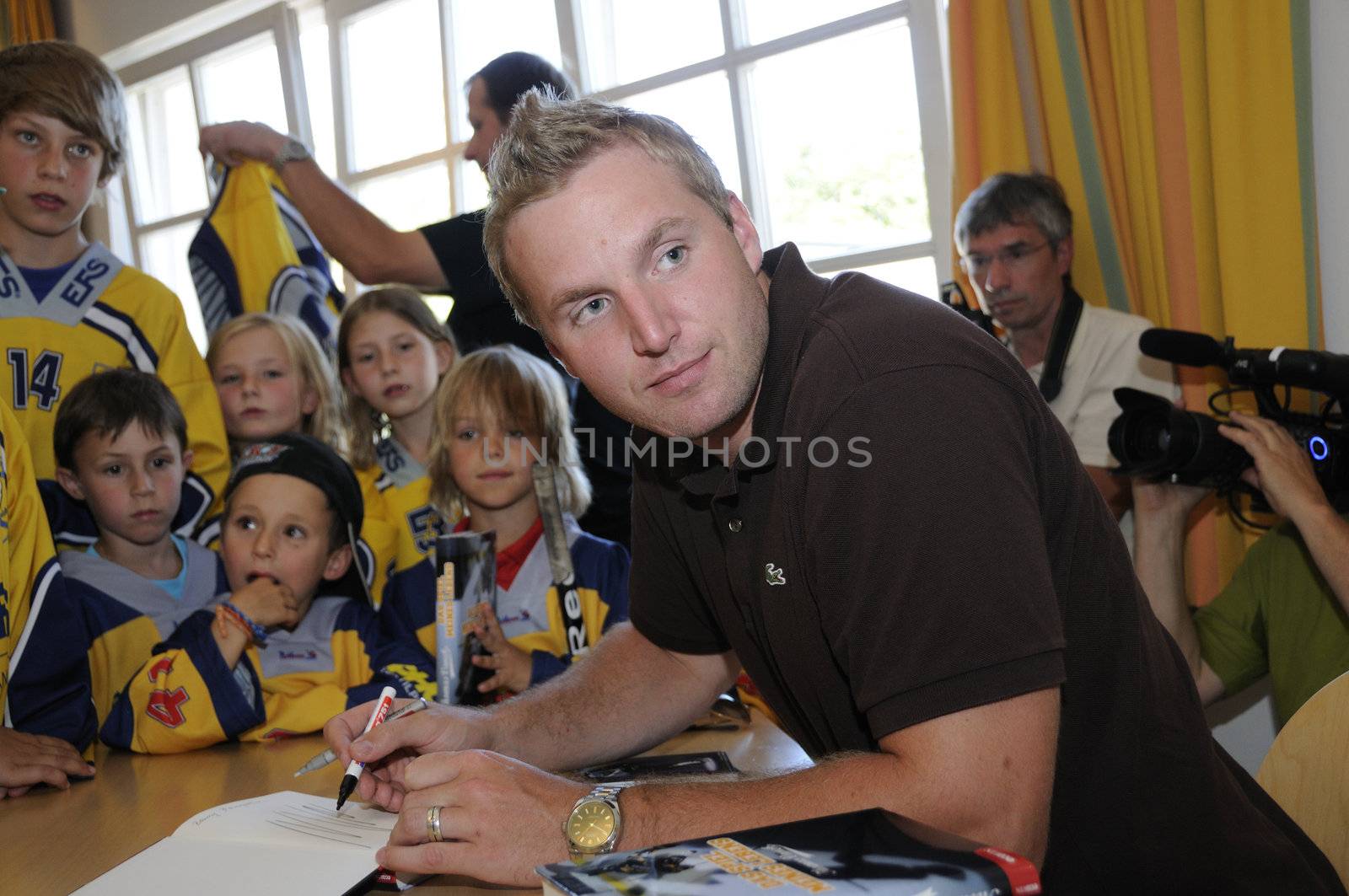 Zell am See, Austria - Jul 8. NHL star player Thomas Vanek visits his hometown Zell am See in Austria on 8th July 2010, to speak to young players of the hockey club Zell am See and giving autographs.