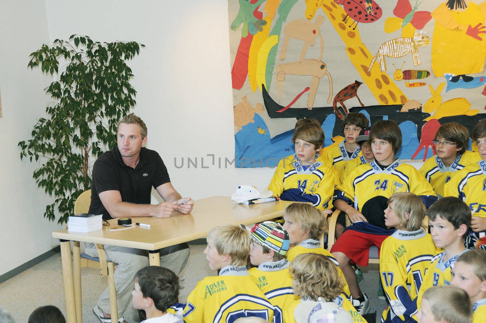 Zell am See, Austria - Jul 8. NHL star player Thomas Vanek visits his hometown Zell am See in Austria on 8th July 2010, to speak to young players of Zell am See and giving autographs.