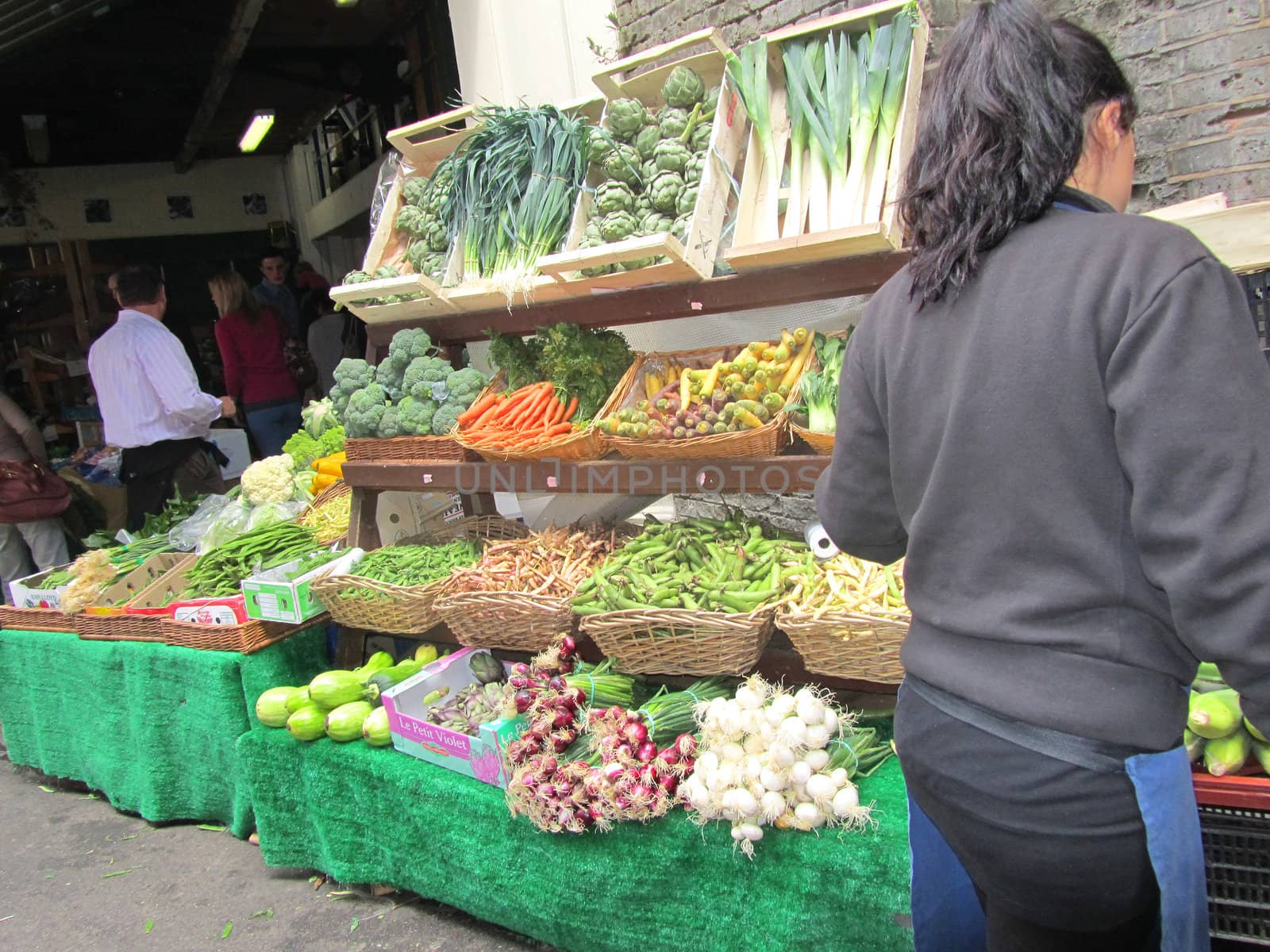 Unidentified woman at a fruit stall at Borough Market on August  by green308