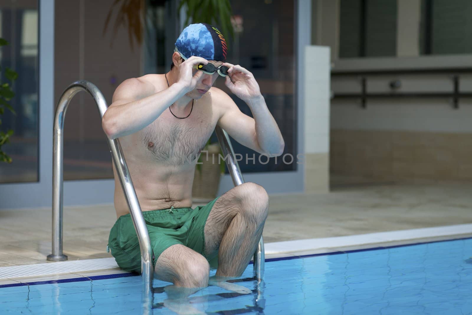 Young man in the pool by krzysiek_z_poczty