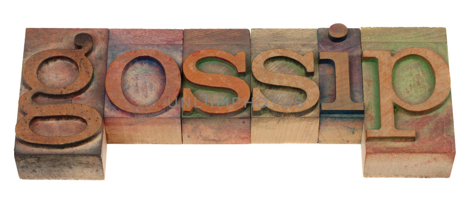 gossip - word spelled in vintage wooden letterpress printing blocks