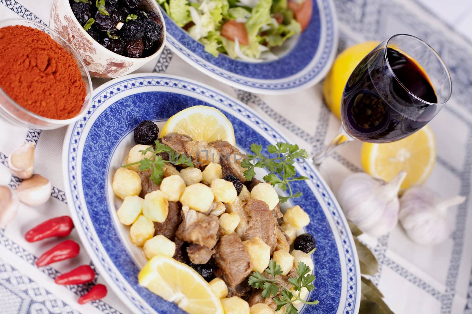 Close up view of a Portuguese meal of cooked meat with potatoes.