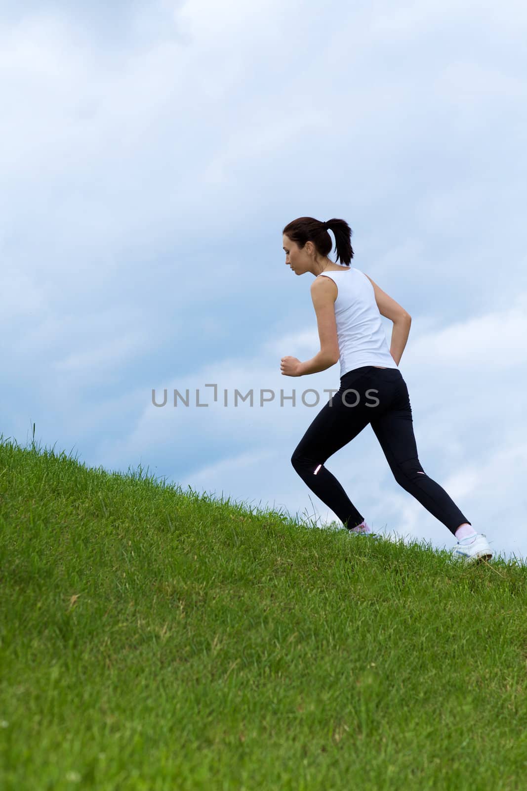 Young woman exercising in park by krzysiek_z_poczty