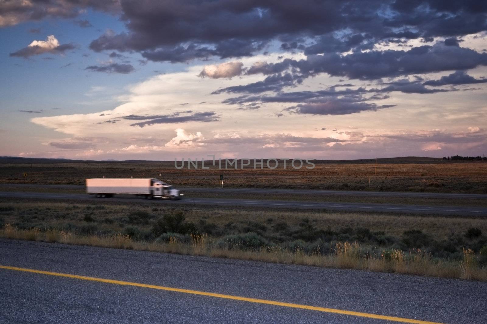 Sunset Driving - blurred Semi-truck