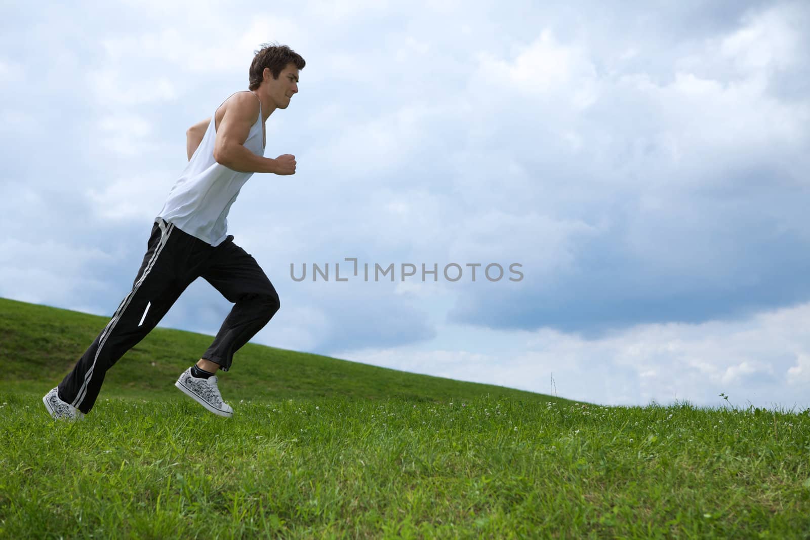Young man exercising in park by krzysiek_z_poczty