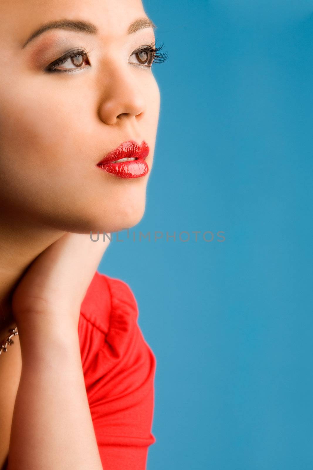 Young chinese girl on a blue background