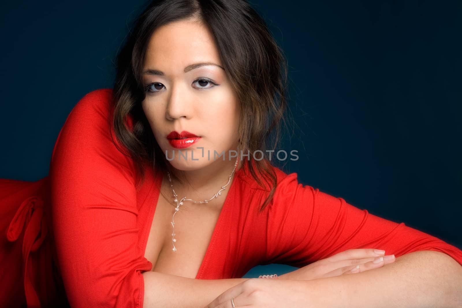 Young glamour chinese girl on a dark background