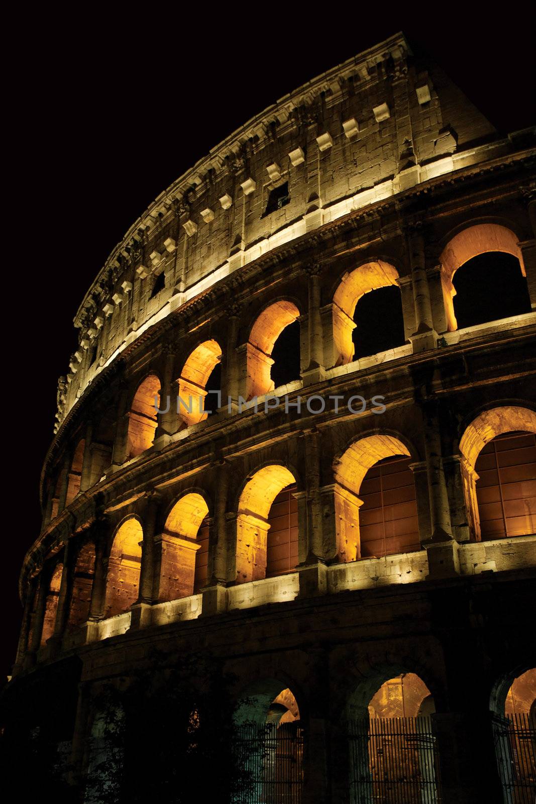 The Colosseum in Rome Italy at night.
