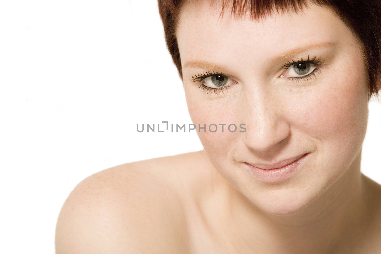 Studio portrait of a young woman with short hair flirting