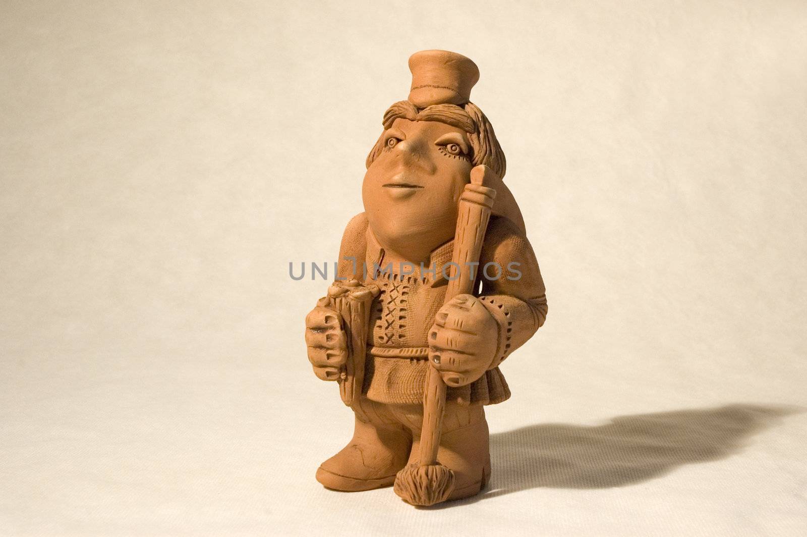 subject is the clay figurine of the peasant