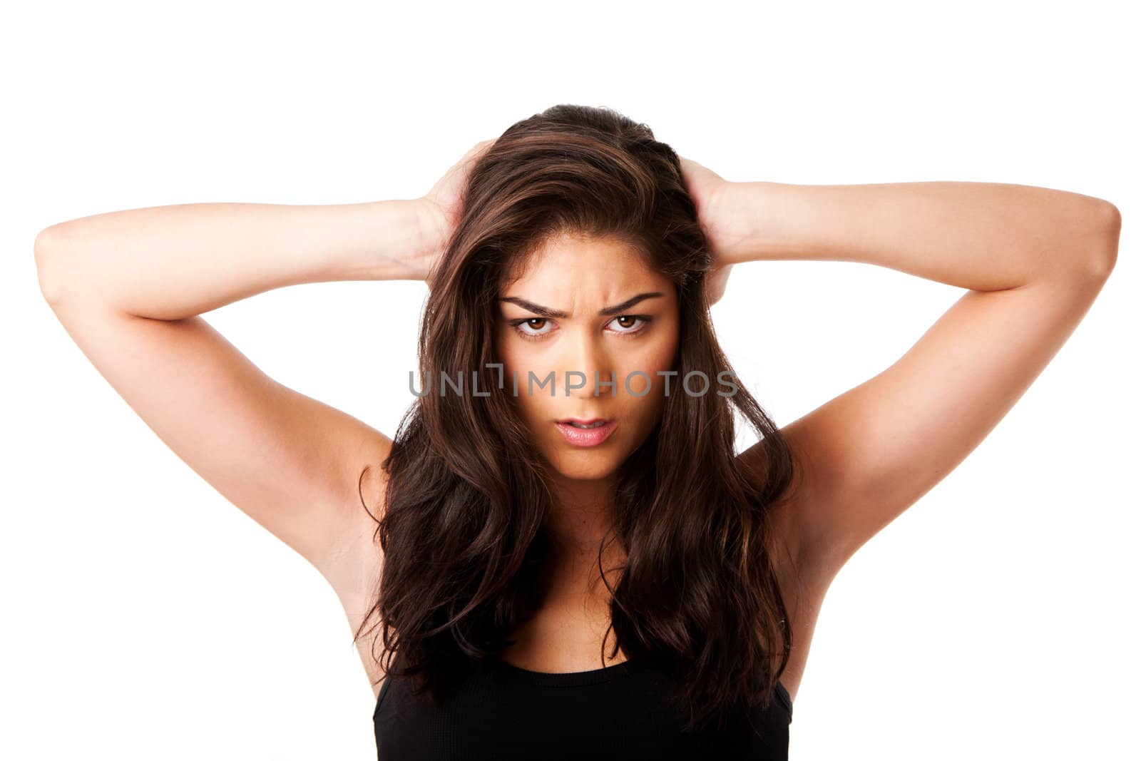 Beautiful face of mad woman expressing stressed holding head with long brown hair, isolated.
