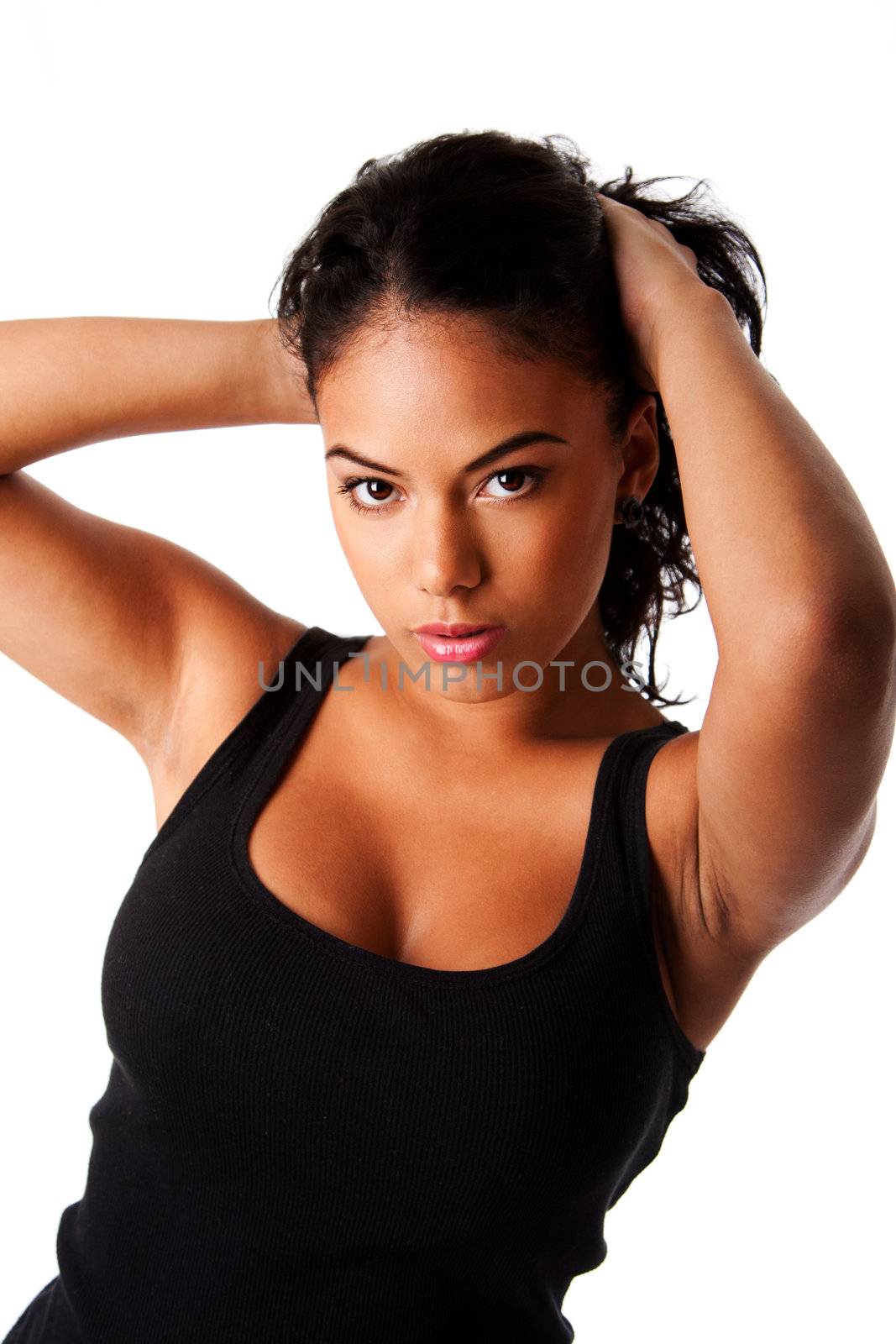 Beautiful Hispanic woman with tanned skin holding pulling up long black hair wearing tank top, isolated.