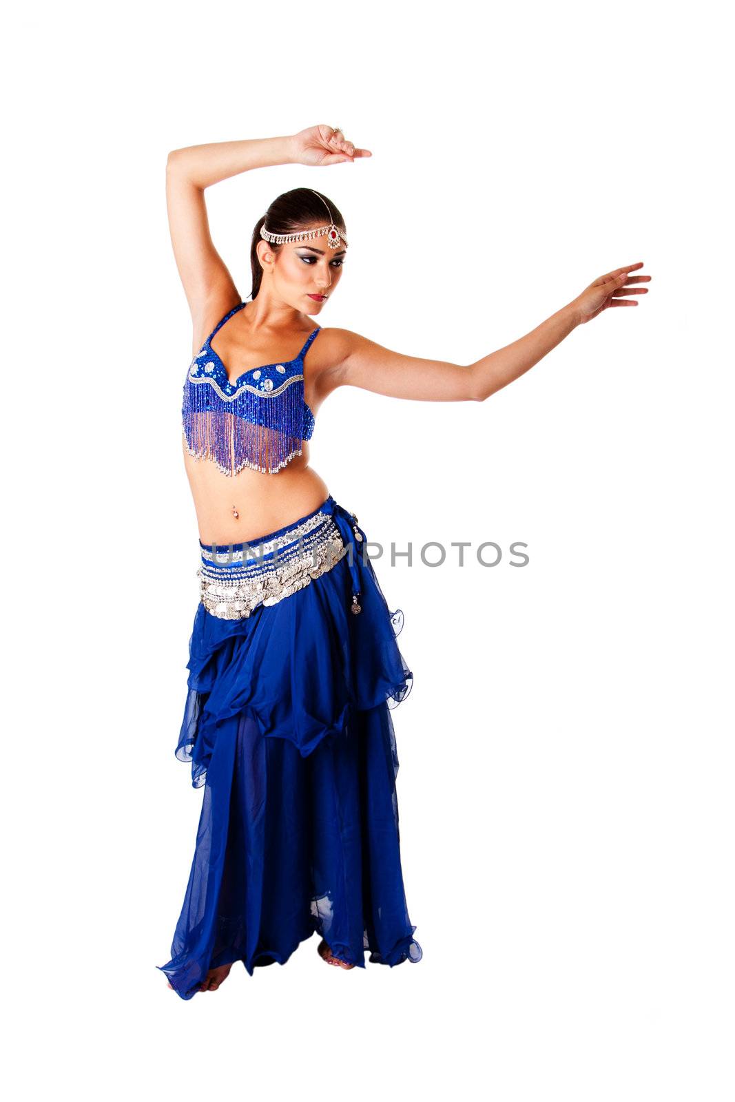 Beautiful Arabic belly dancer harem woman in blue with silver dress and head jewelry with gem dancing swirling her arms, isolated.