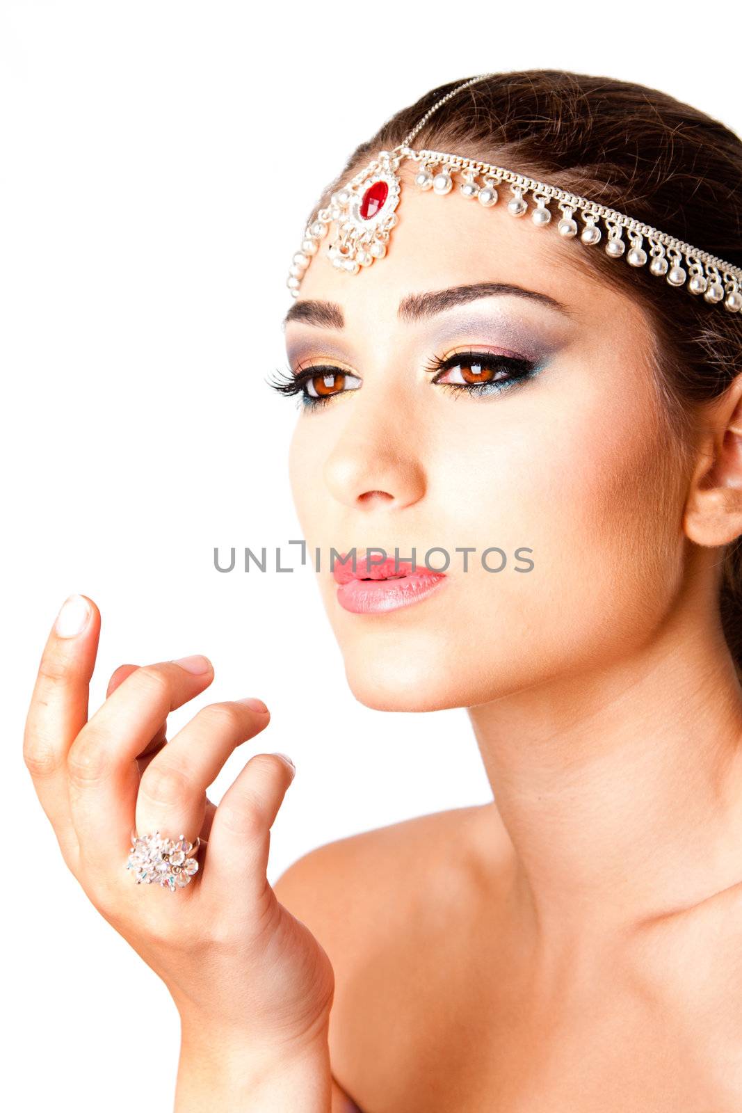 Hand in front of a beautiful Middle Eastern Egyptian Israeli Lebanese Turkish Arabic woman Face with makeup in the Belly Dancer style, isolated.