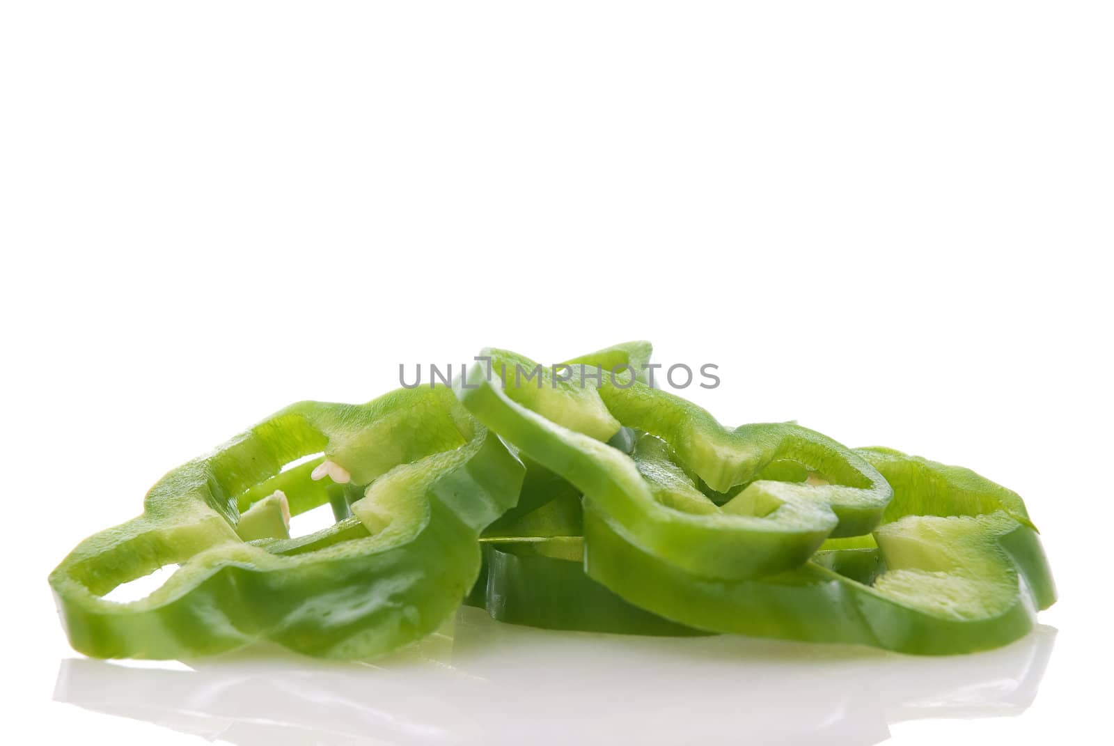 Sliced green pepper isolated on white background.