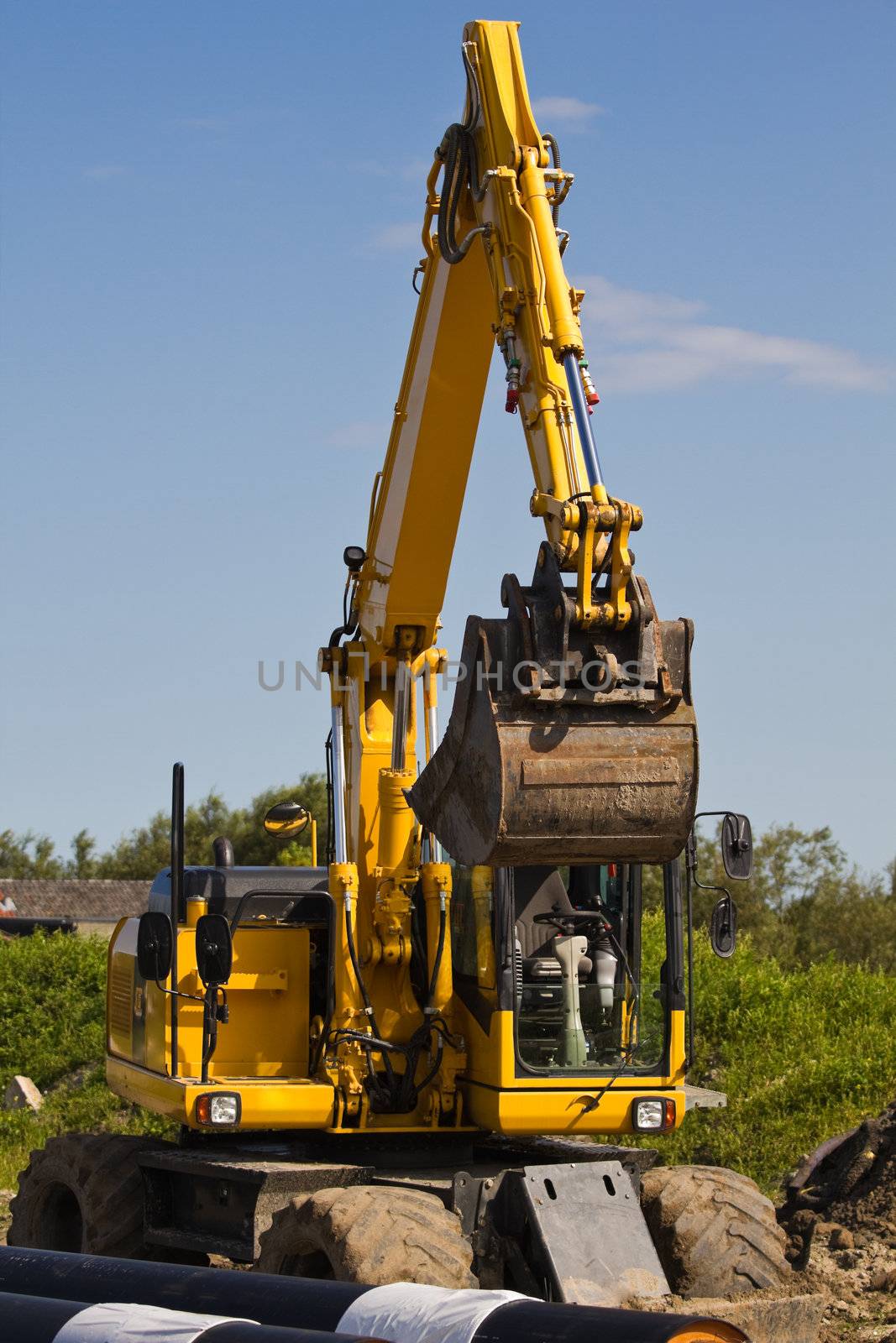 Excavator at work digging up ground  