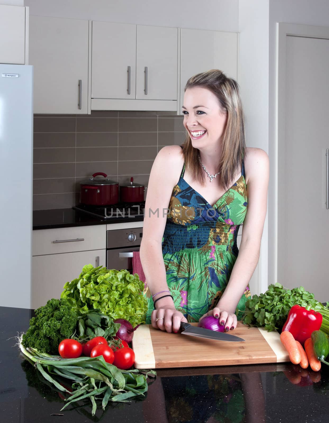 young woman preparing healthy vegetables by clearviewstock