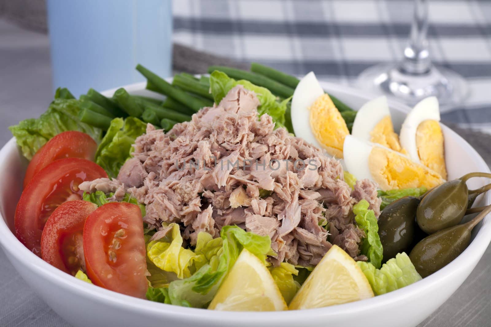 Close up of bowl of salad Nicoise .