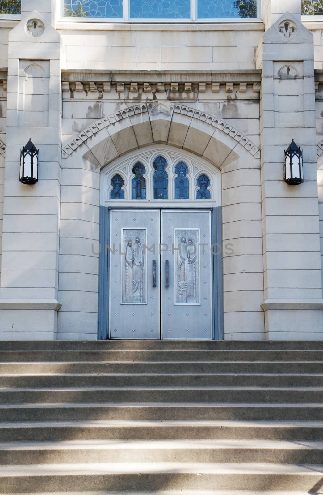 Concrete stairs leading to metal church doors