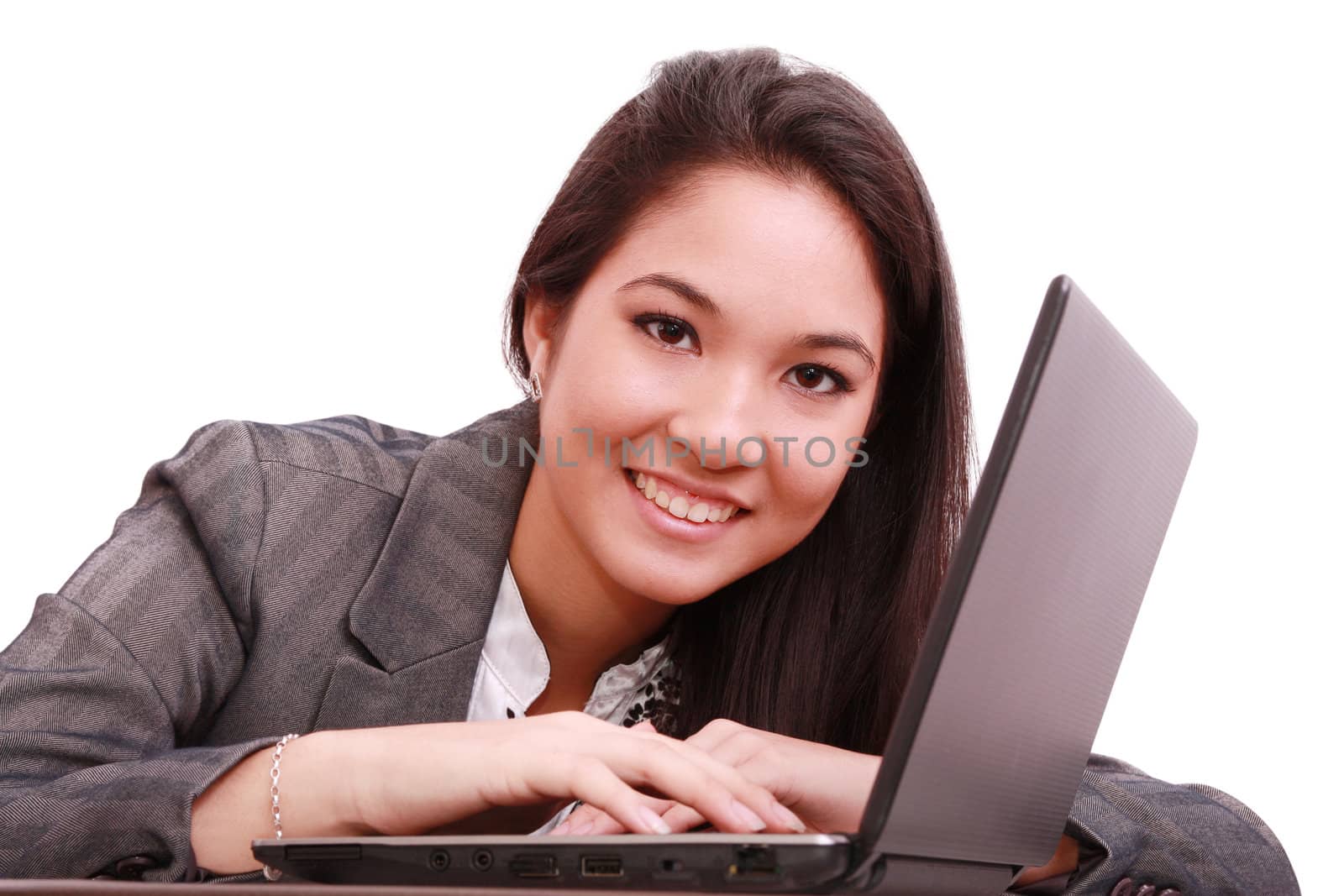 portrait of a cute smiling businesswoman working on a laptop
