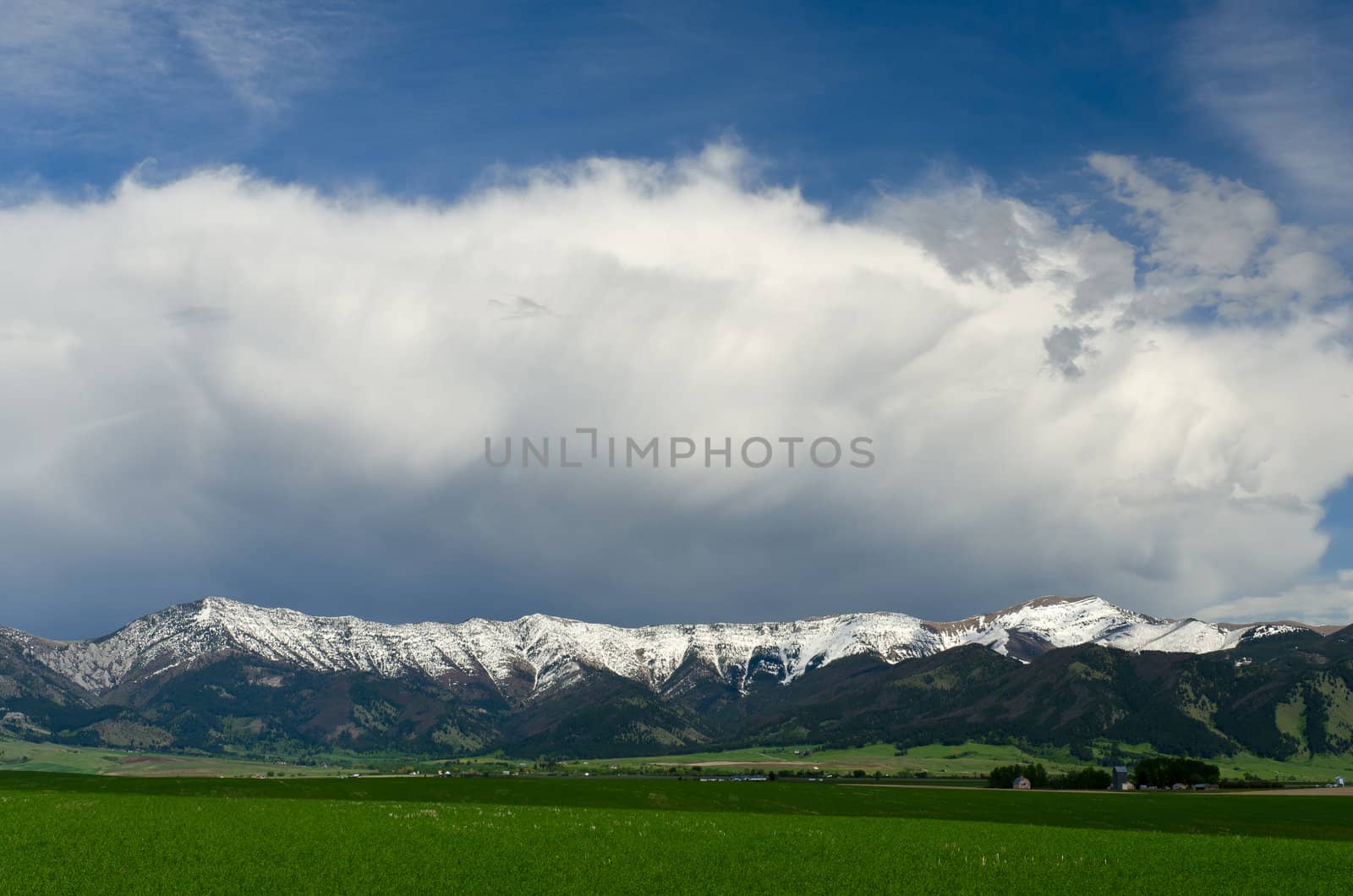 Spring fields, the Bridger Mountains and clearing storm clouds, Gallatin County, Montana, USA by CharlesBolin