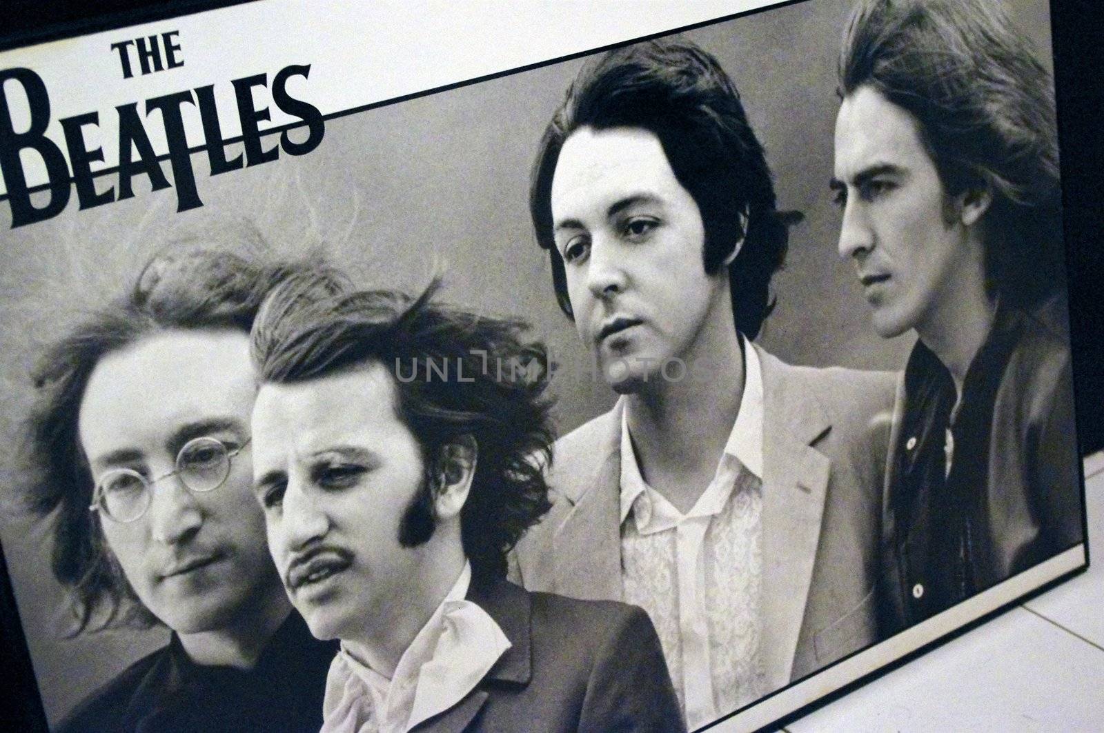A mounted poster of the English rock band, The Beatles. No other group in history has generated more public thirst for merchandise than The Beatles.