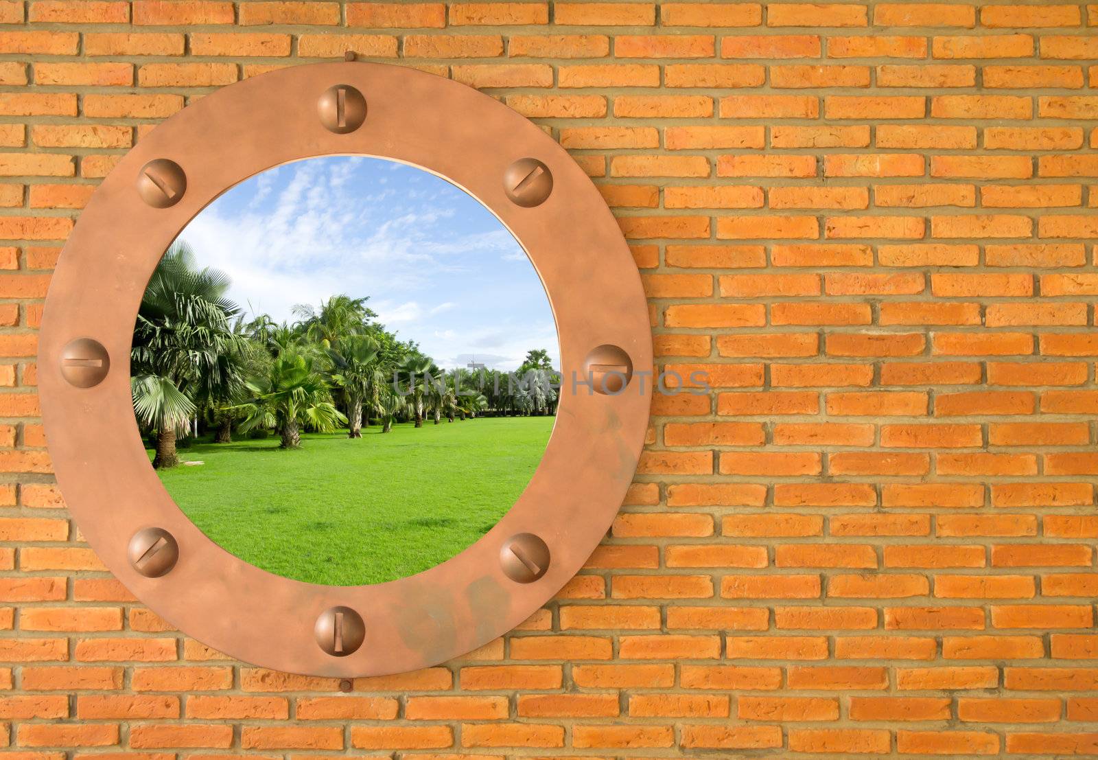 Blue sky in hole in old wall, brick frame by rufous