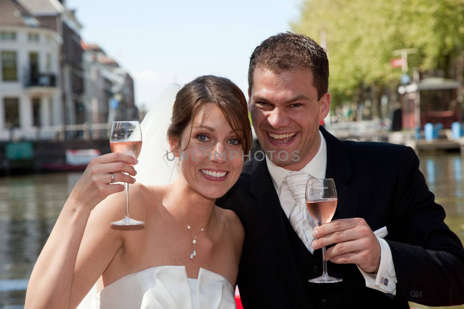 Beautiful young couple having a toast to their wedding