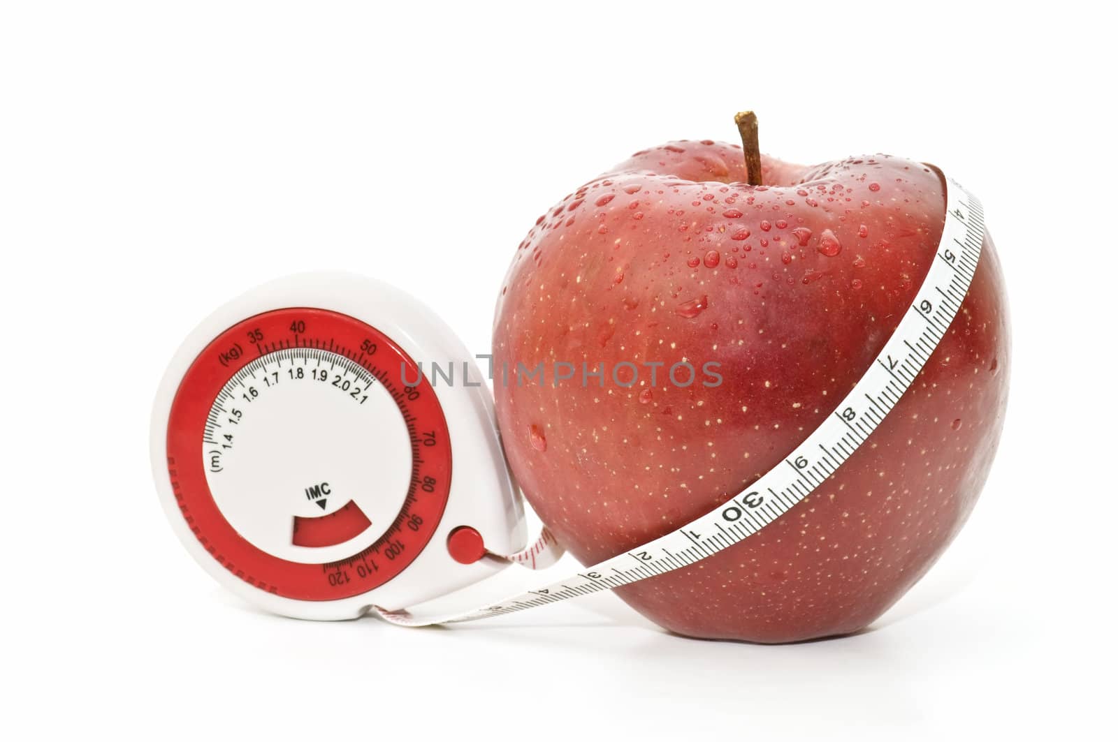 meters and apple on  white background
