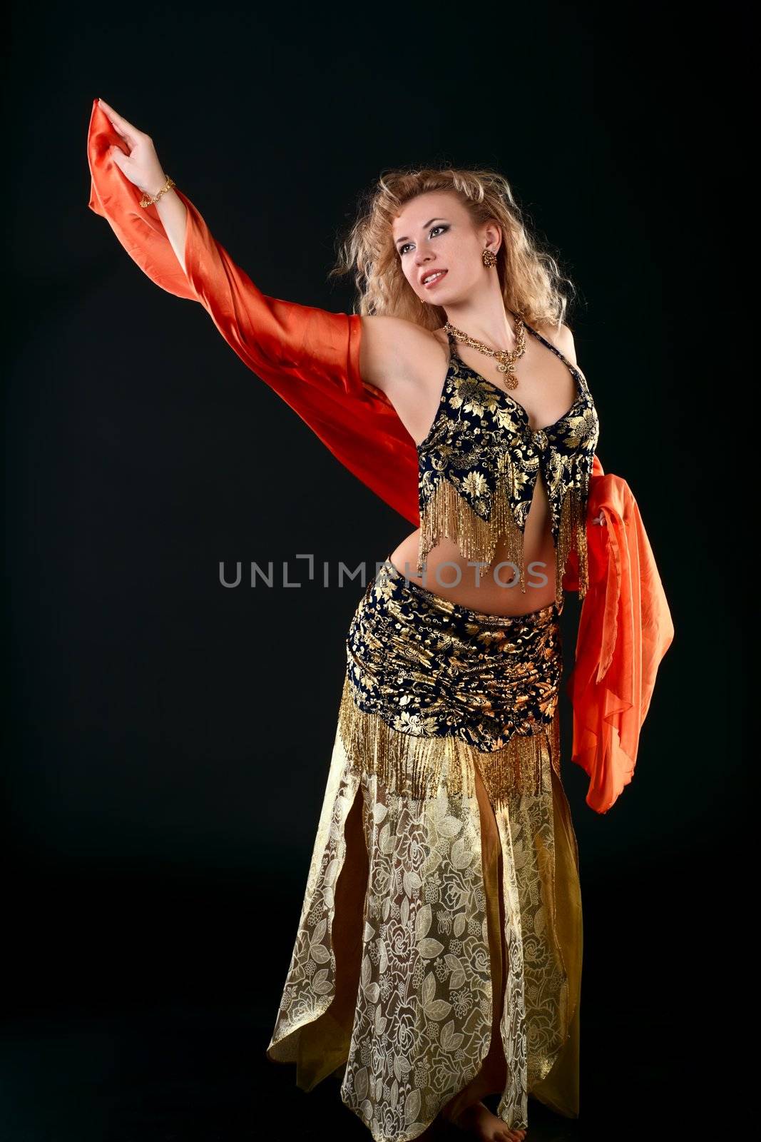 Young blonde belly dancer in black.