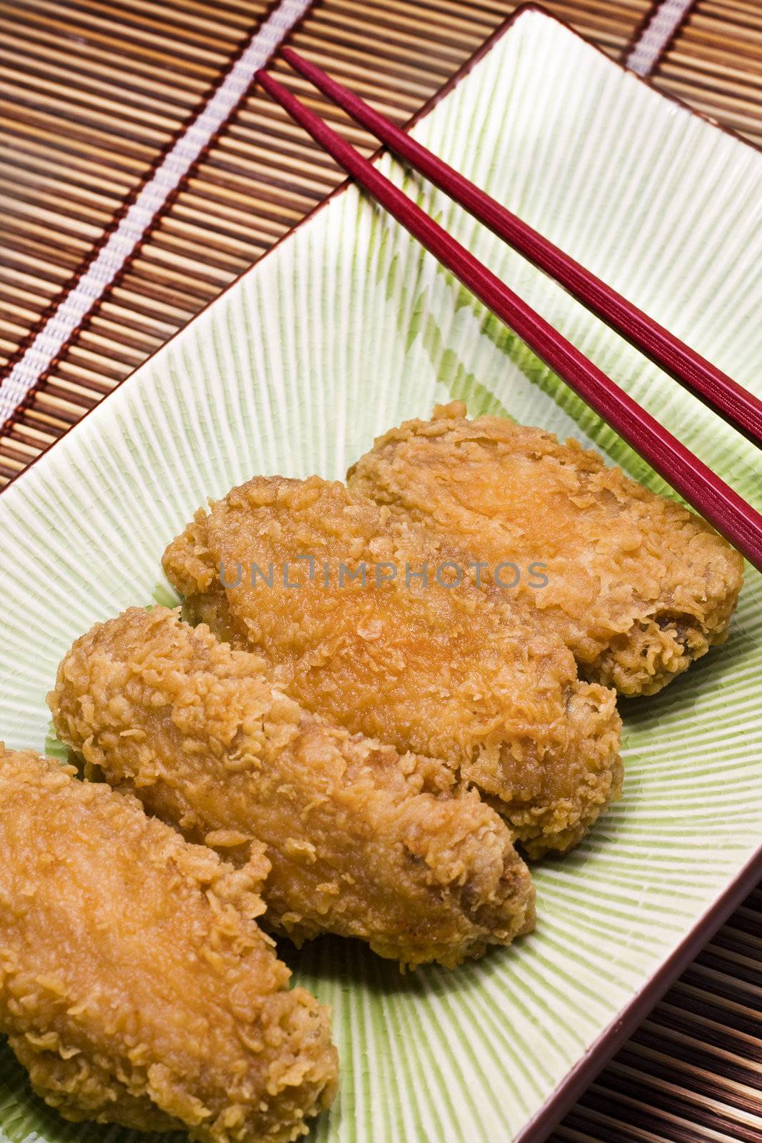 Chicken wings on the table and chopstick