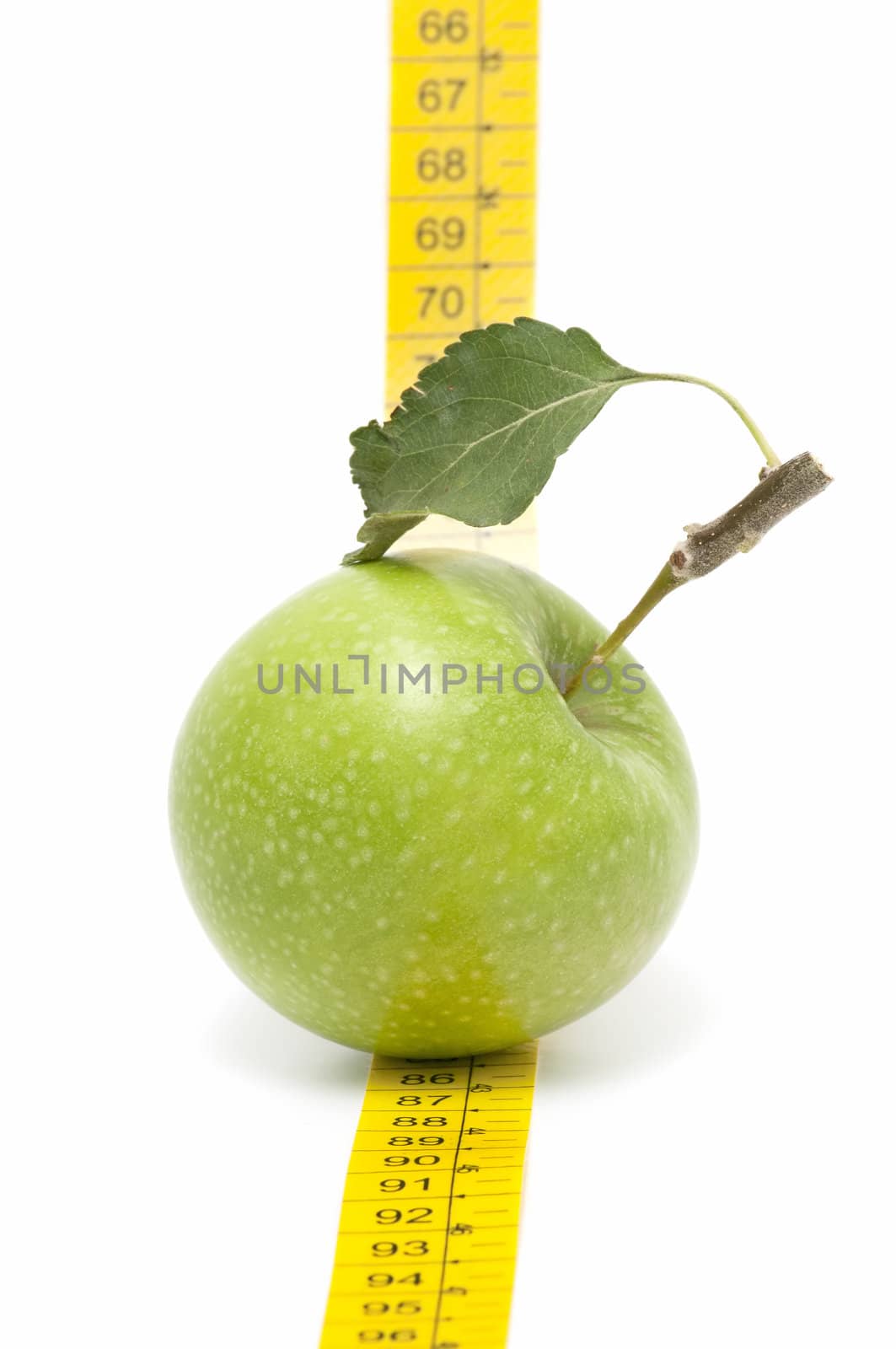 meters and apple on  white background
