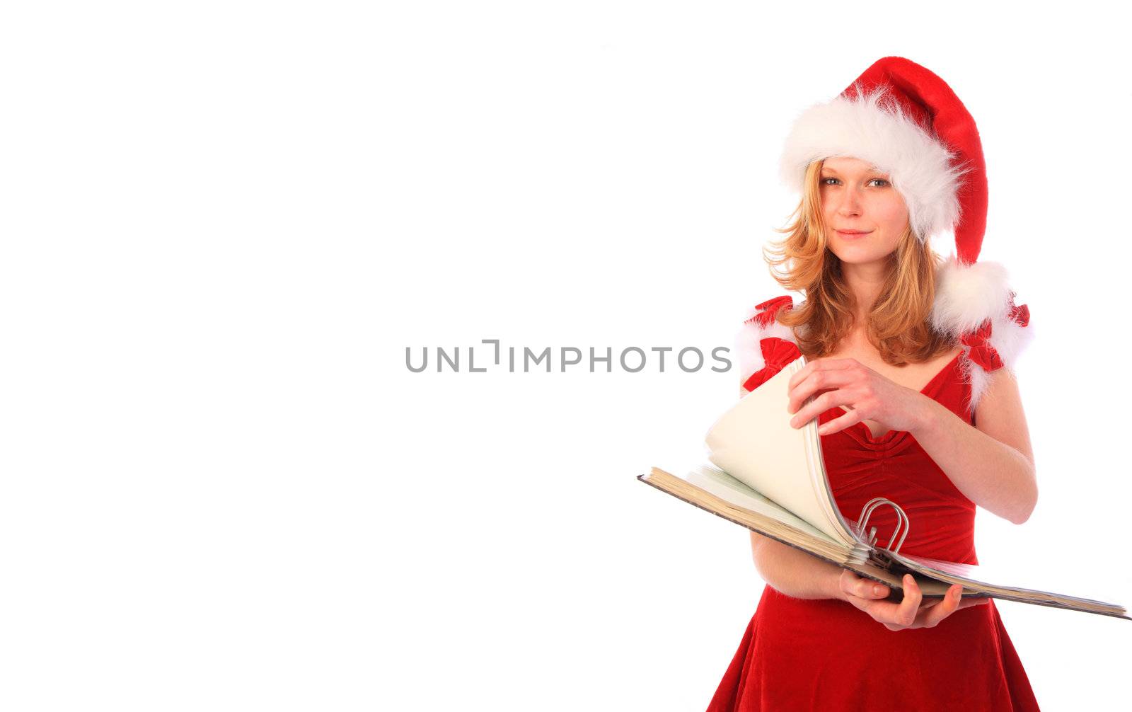 miss santa is holding a ring binder and page turning - bookkepping and paper work - whitespace on the left