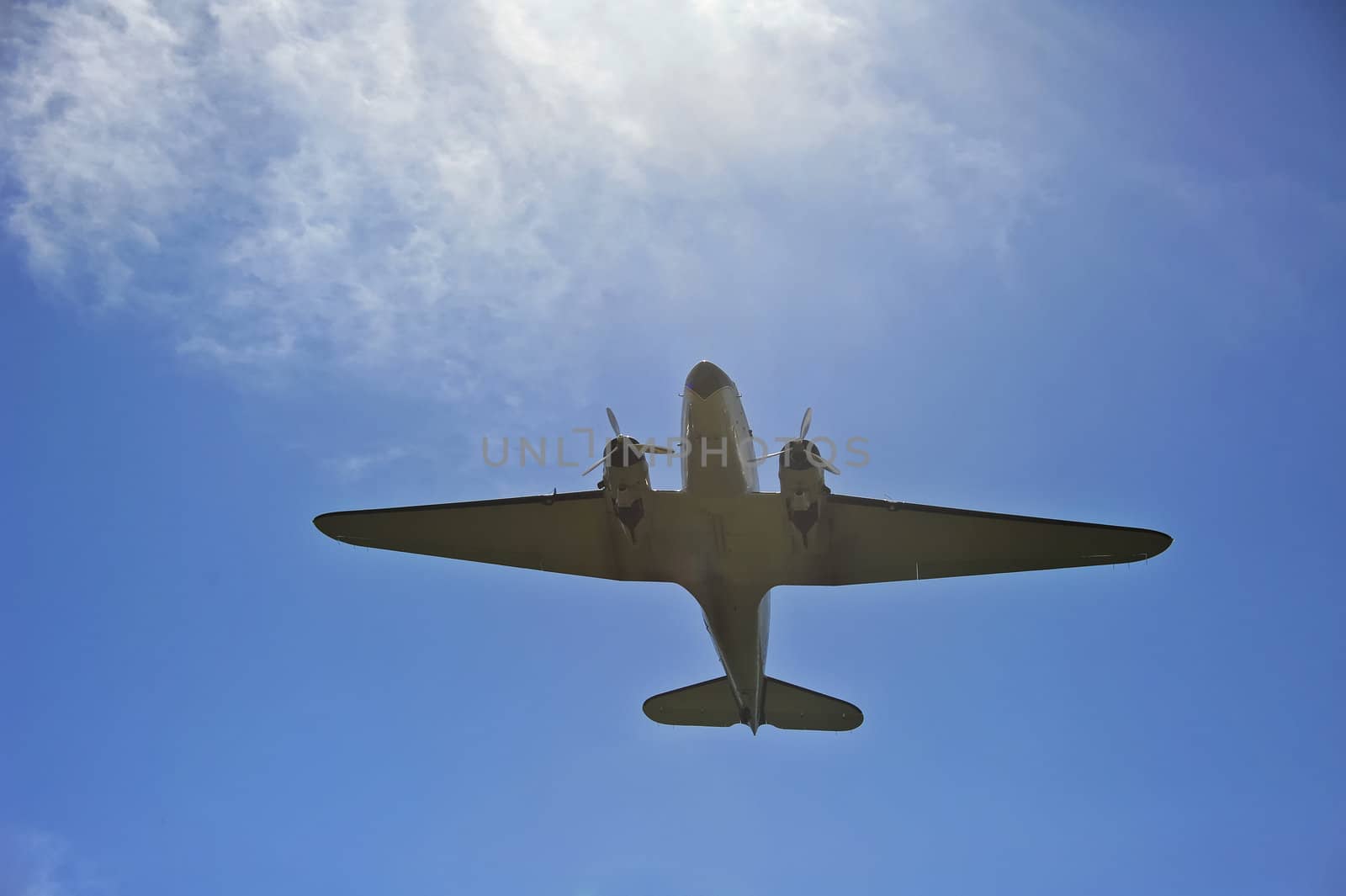 Douglas DC-3A flying overhead by Bateleur
