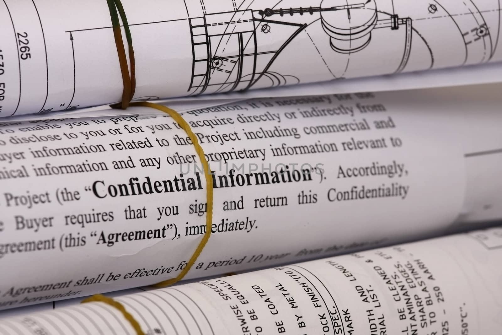 Confidential information on blueprints - shallow dof focus on confidential information.
