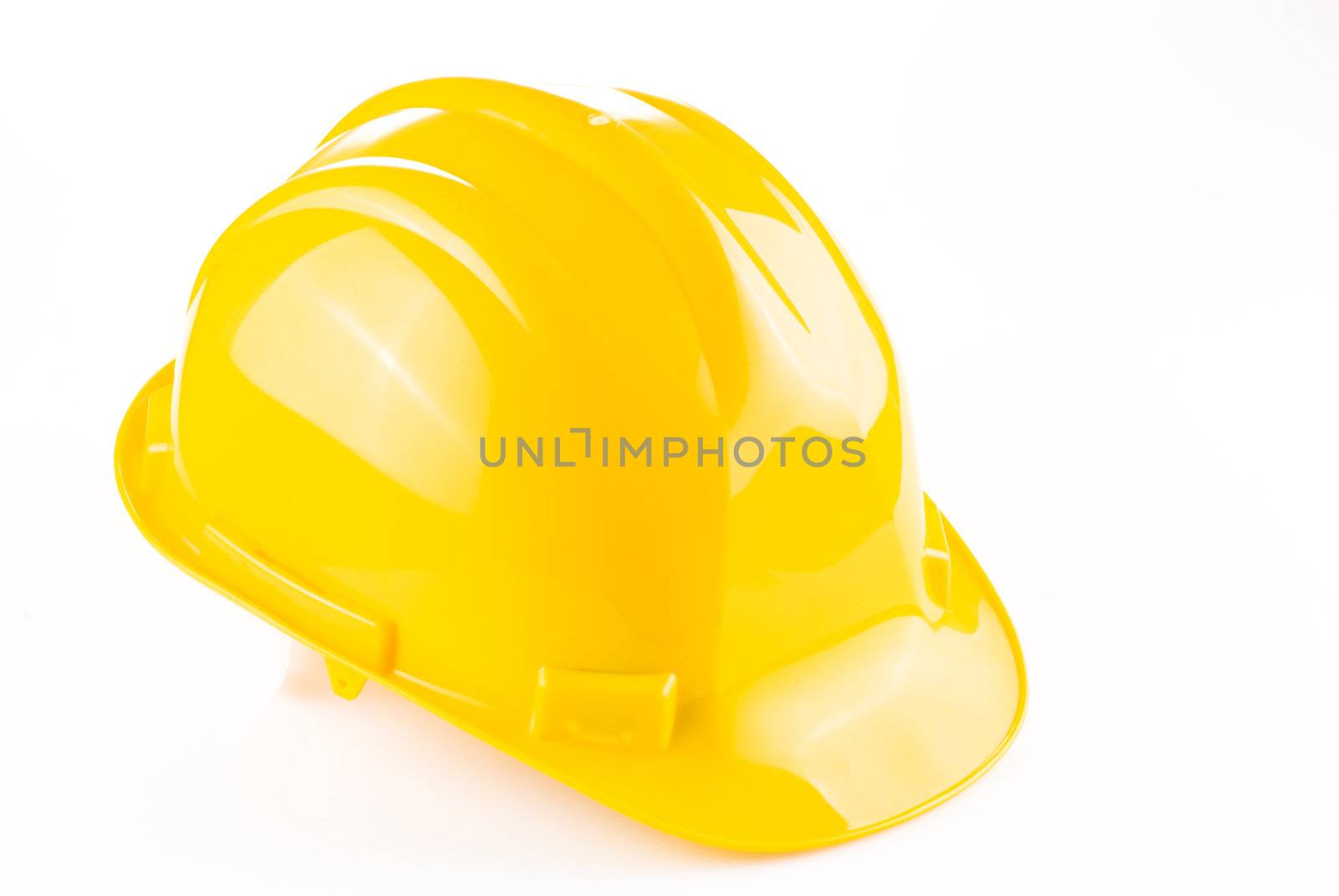 Yellow safety hat isolated over white background
