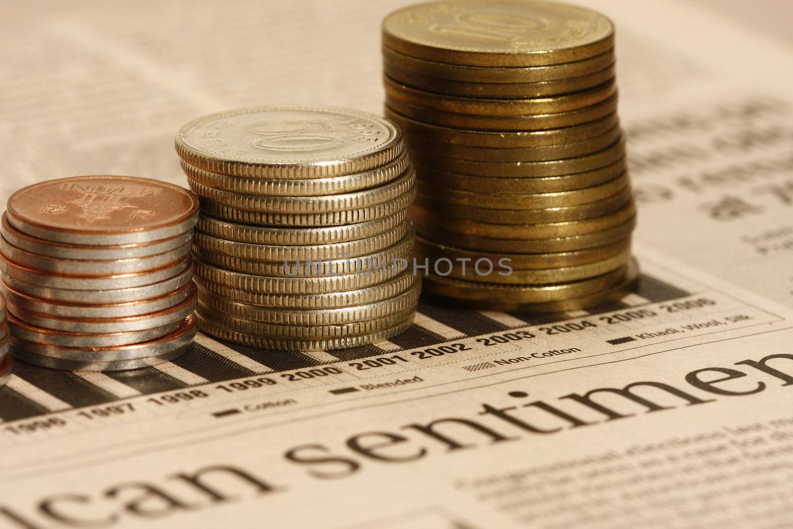 macro shot of Coins on stocks graph