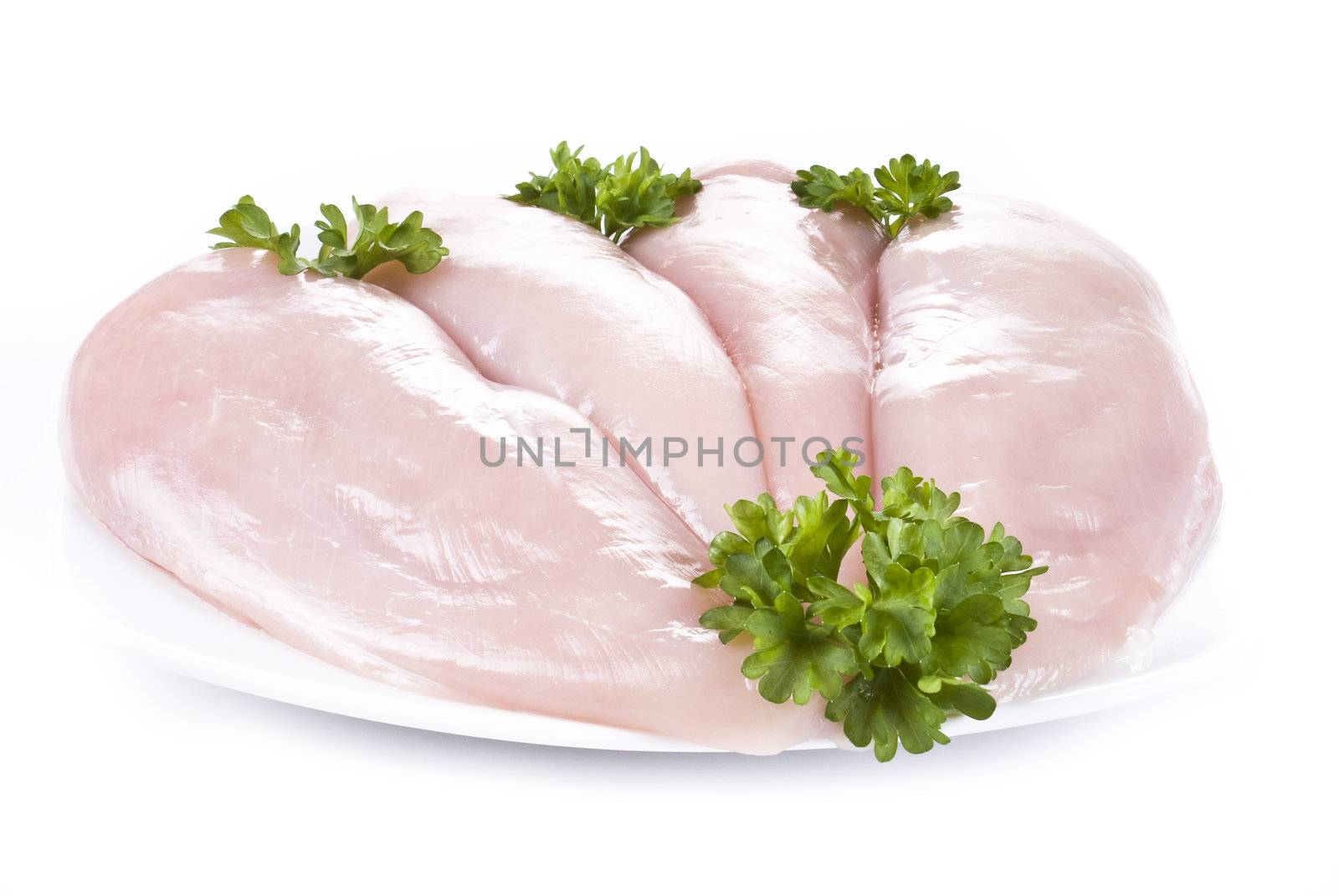 Raw chicken breasts by caldix