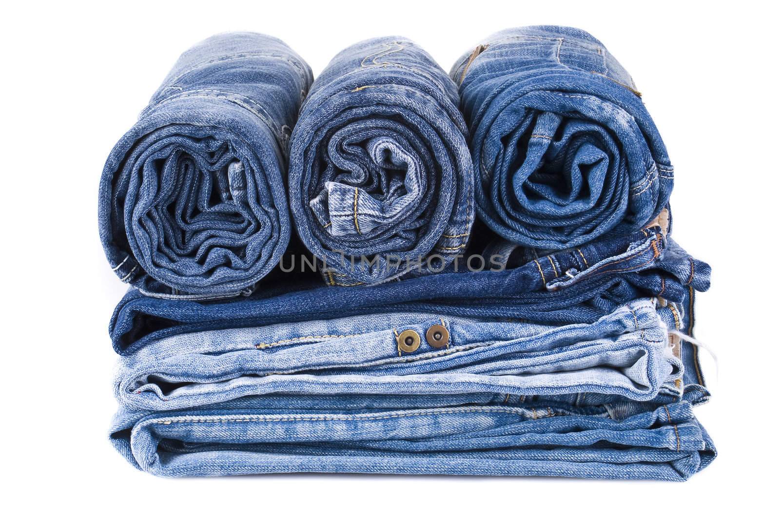 stack of blue denim jeans by caldix