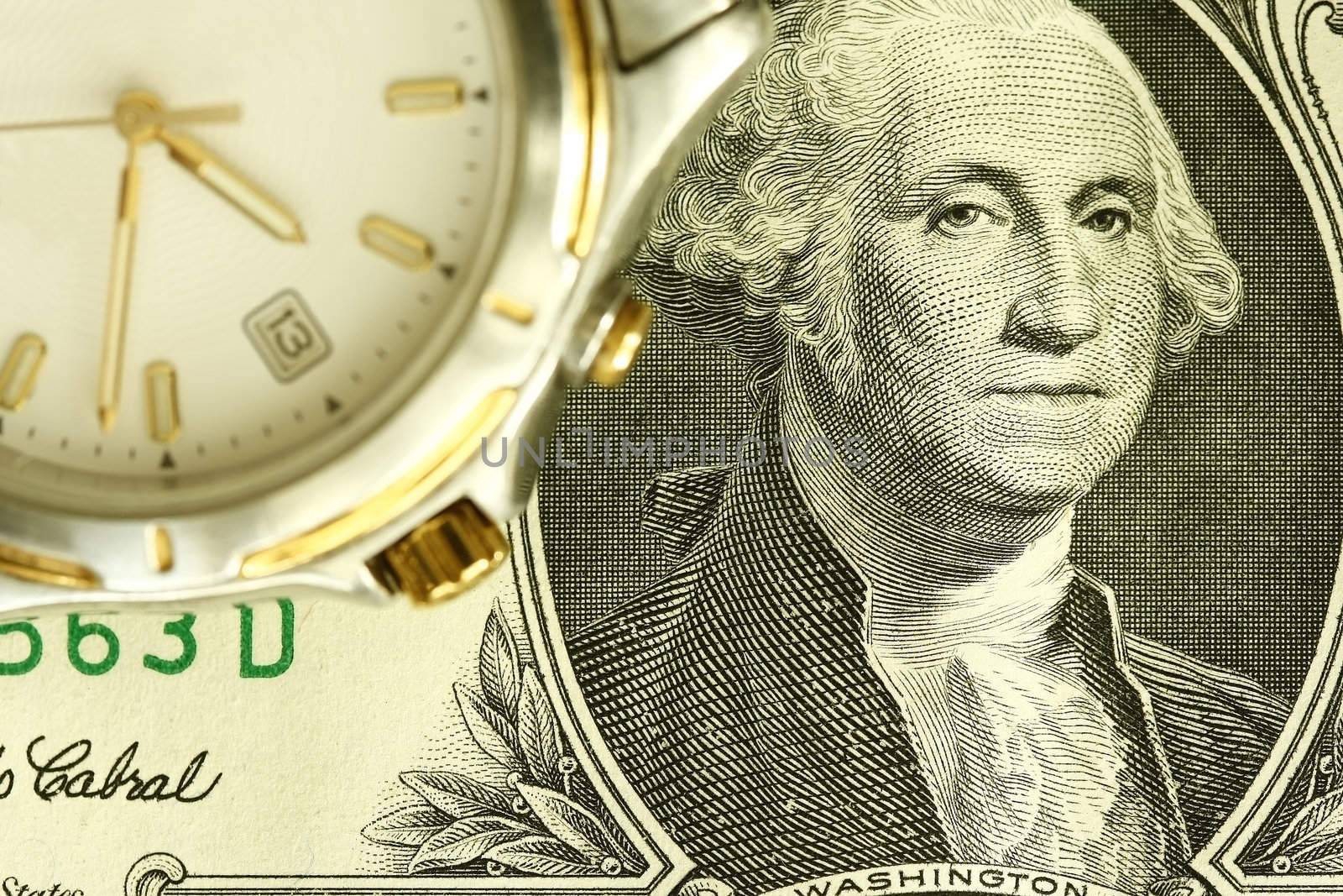 Wrist watch and US currency - concept for time is money.