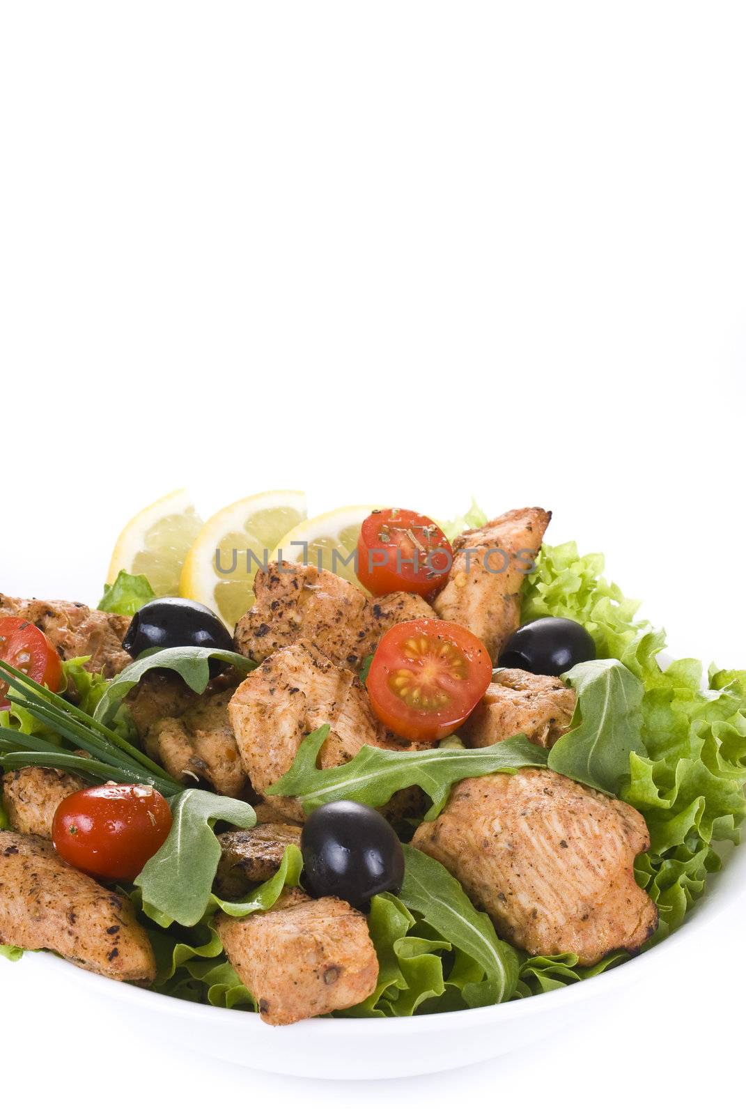 Chicken and vegetable salad isolated over white background