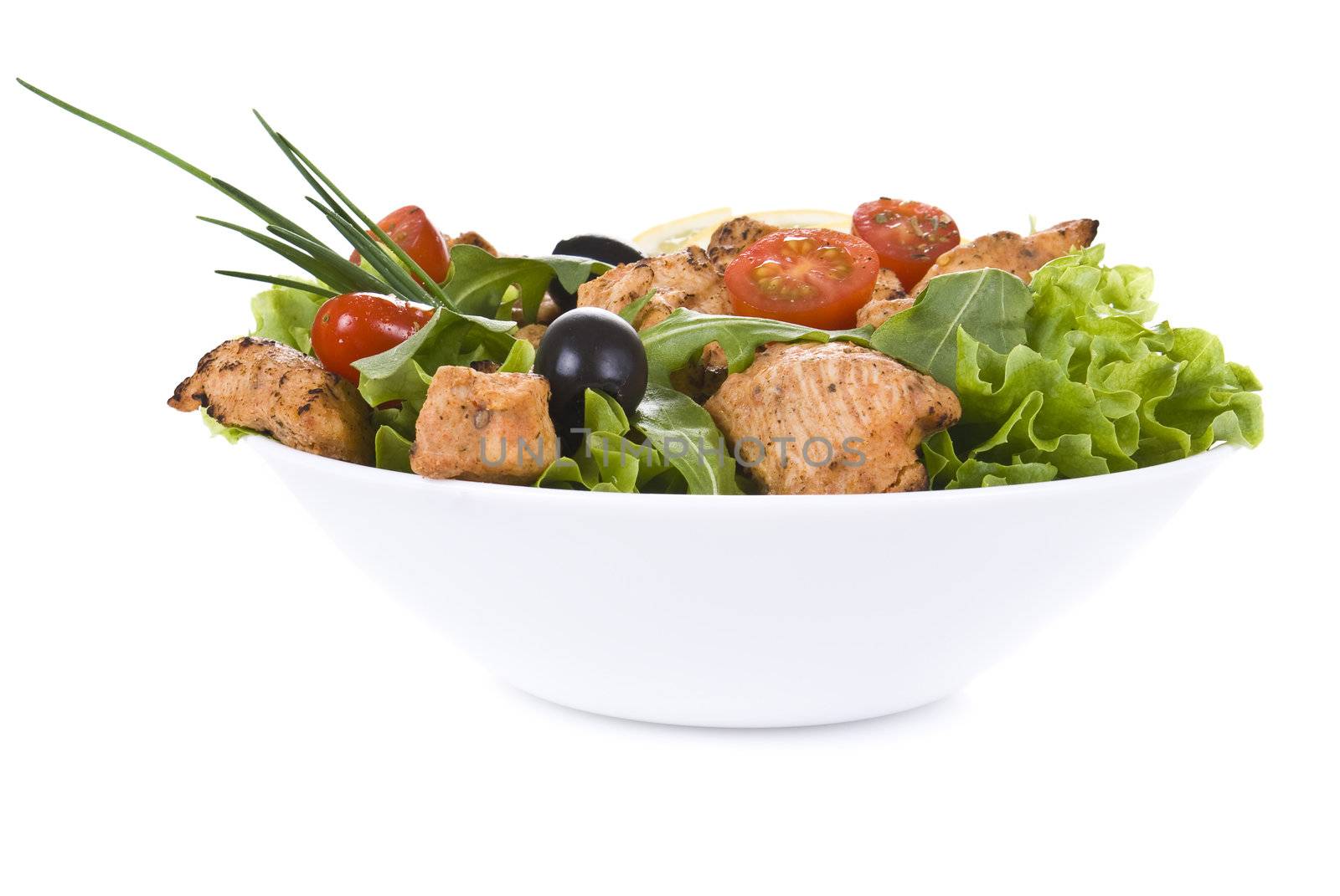 Chicken and vegetable salad isolated over white background