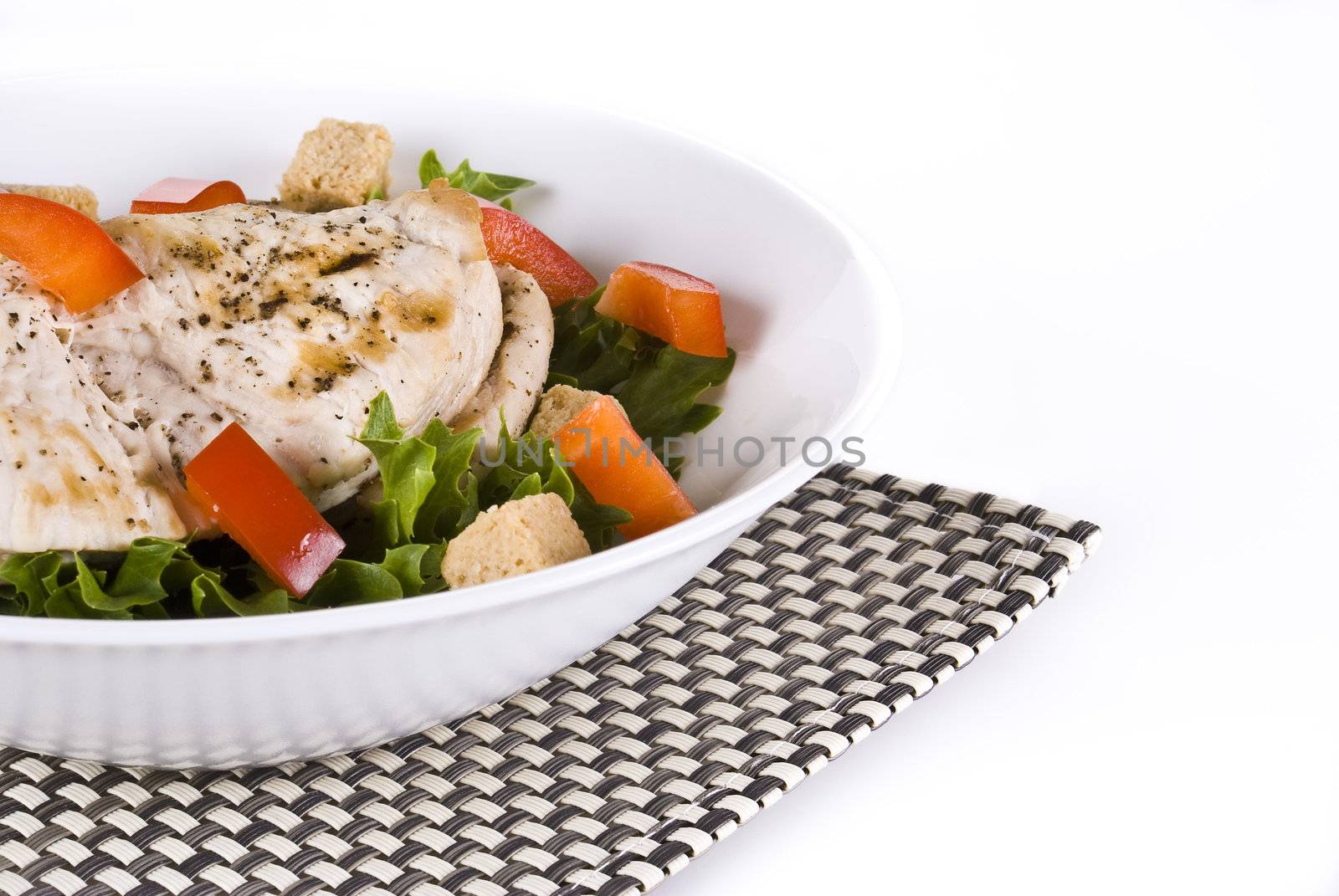 Fresh chicken and vegetable salad - isolated over white background